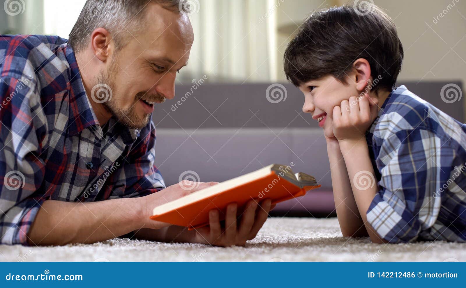 dad reading son exciting fantasy book, imagination and creativity, leisure time