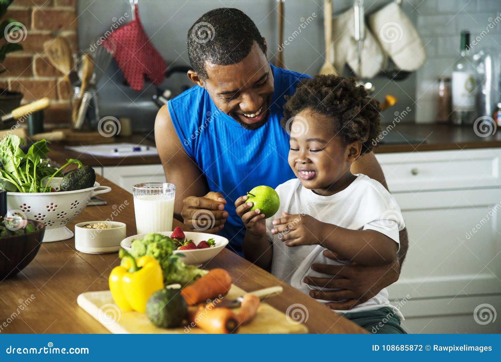 dad and son cooking together