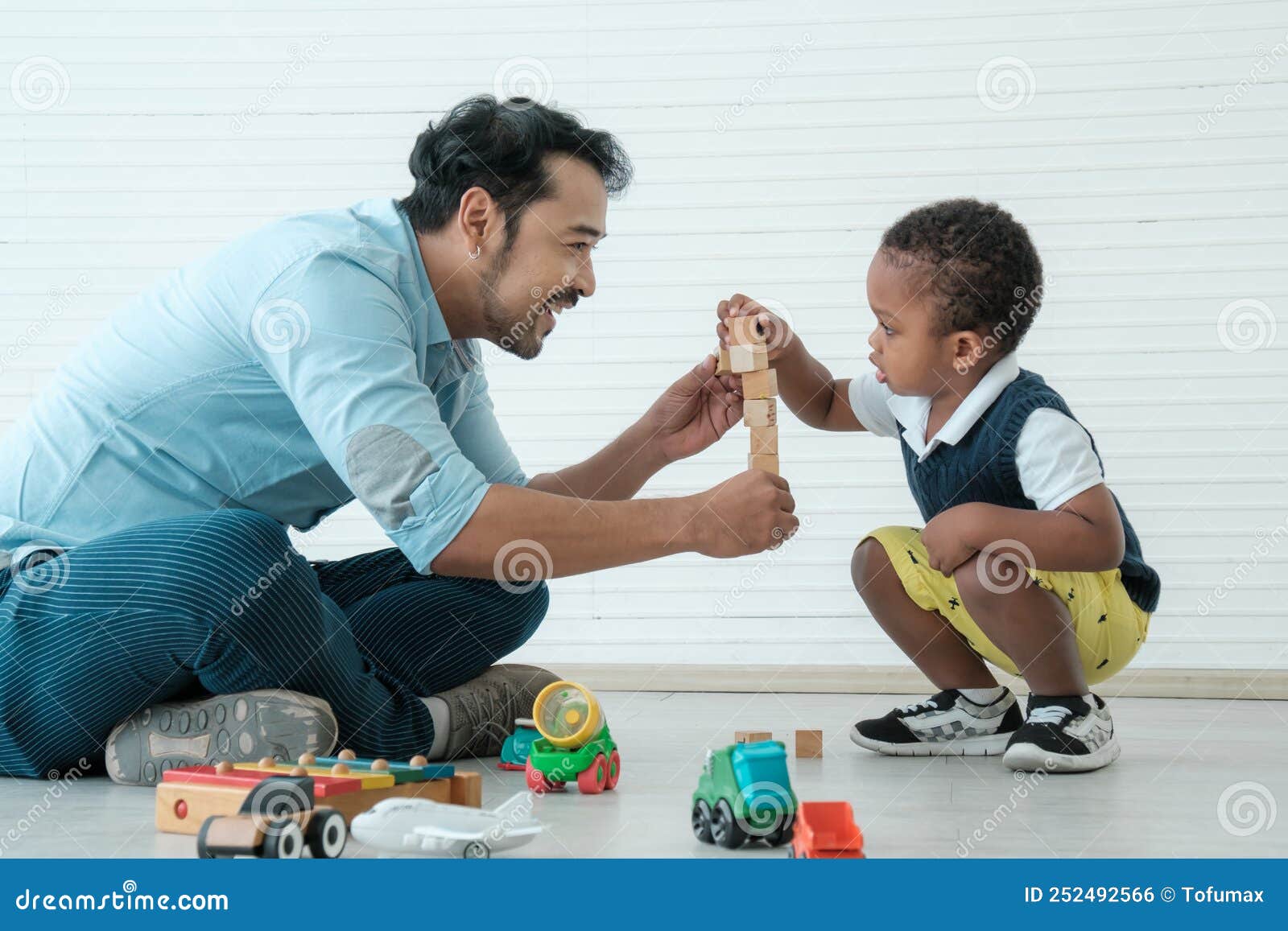 Daddy and Son Enjoy Using Times Together Stock Photo Image of