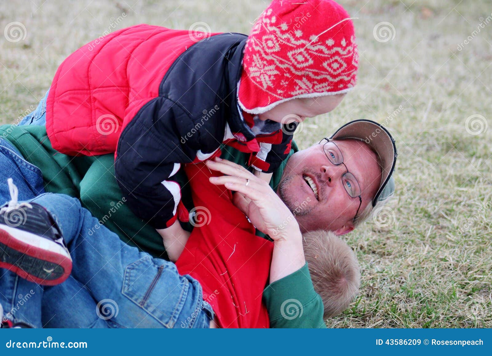 Daddy And Sons Wrestling In The Grass Stock Photo Image 43586209