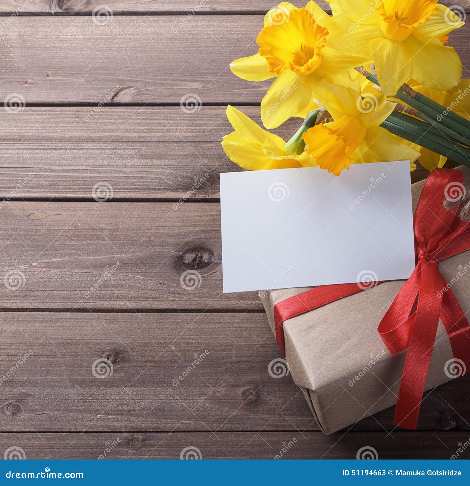 Daffodils with gift box stock image. Image of wooden 51194663
