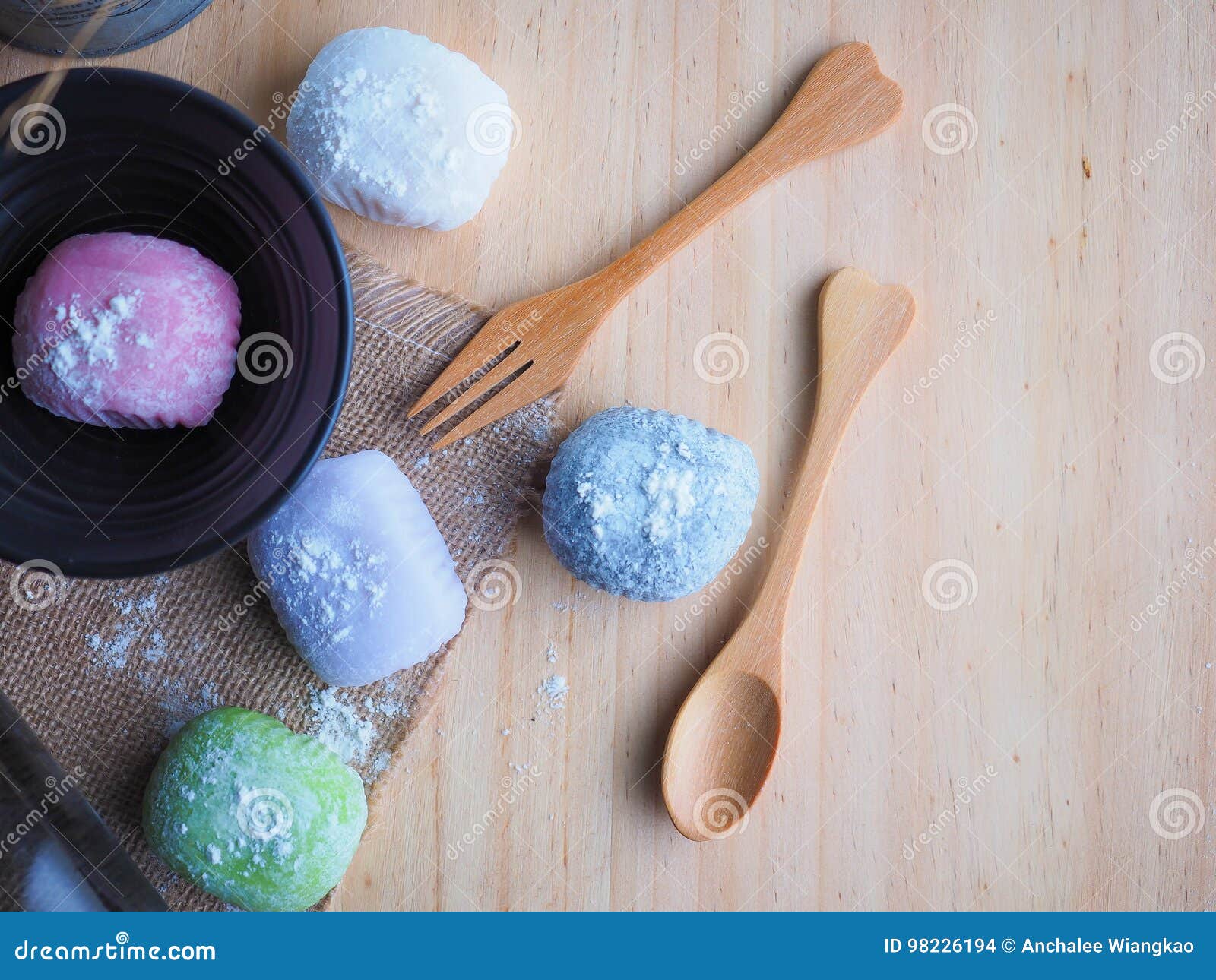 daifuku, japan dessert with wood spoon on wood background