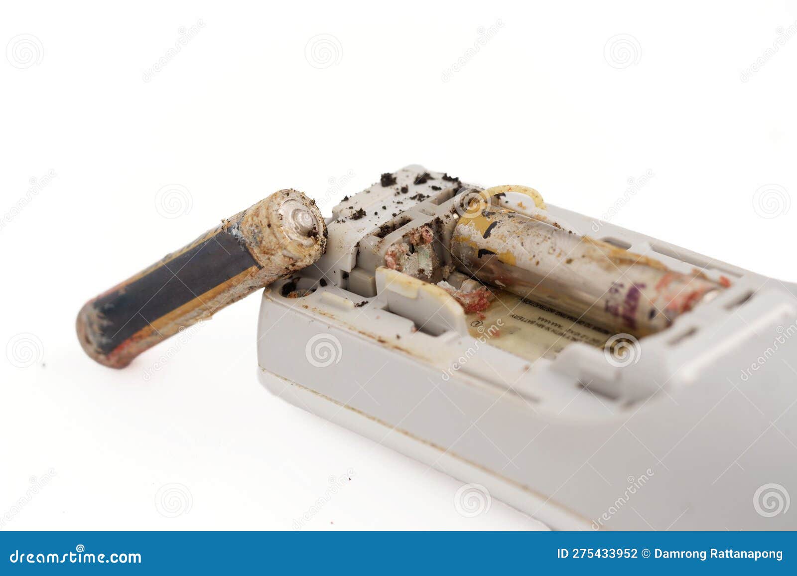 Damaged and Corroded Batteries in Electronic Devices Isolated on White