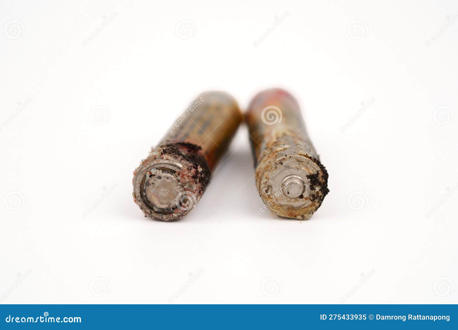 Damaged and Corroded Batteries Isolated on White Background Stock Image