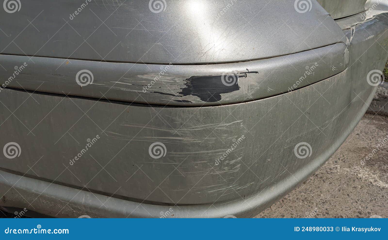 Damaged and Scratched Bumper on the Car. Damaged Paint. Stock Image