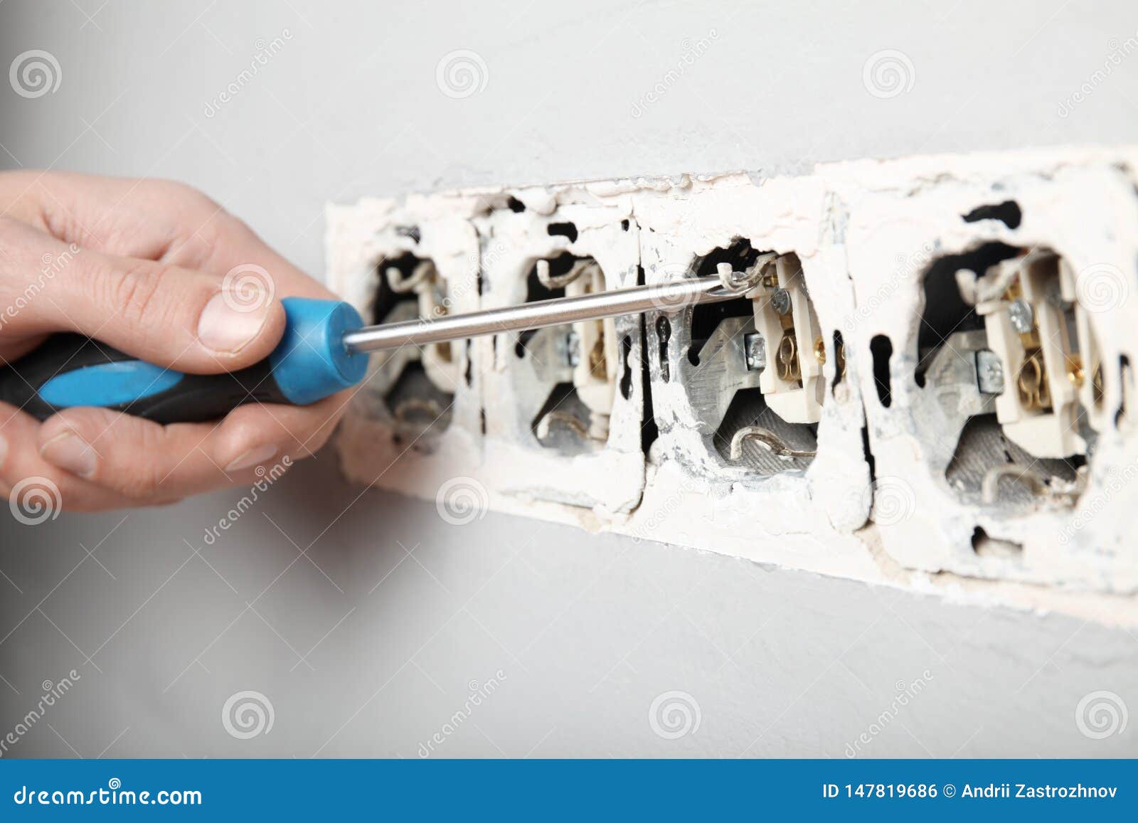 Damaged Wires in Electrical Outlet in Wall. Violation of Electrical