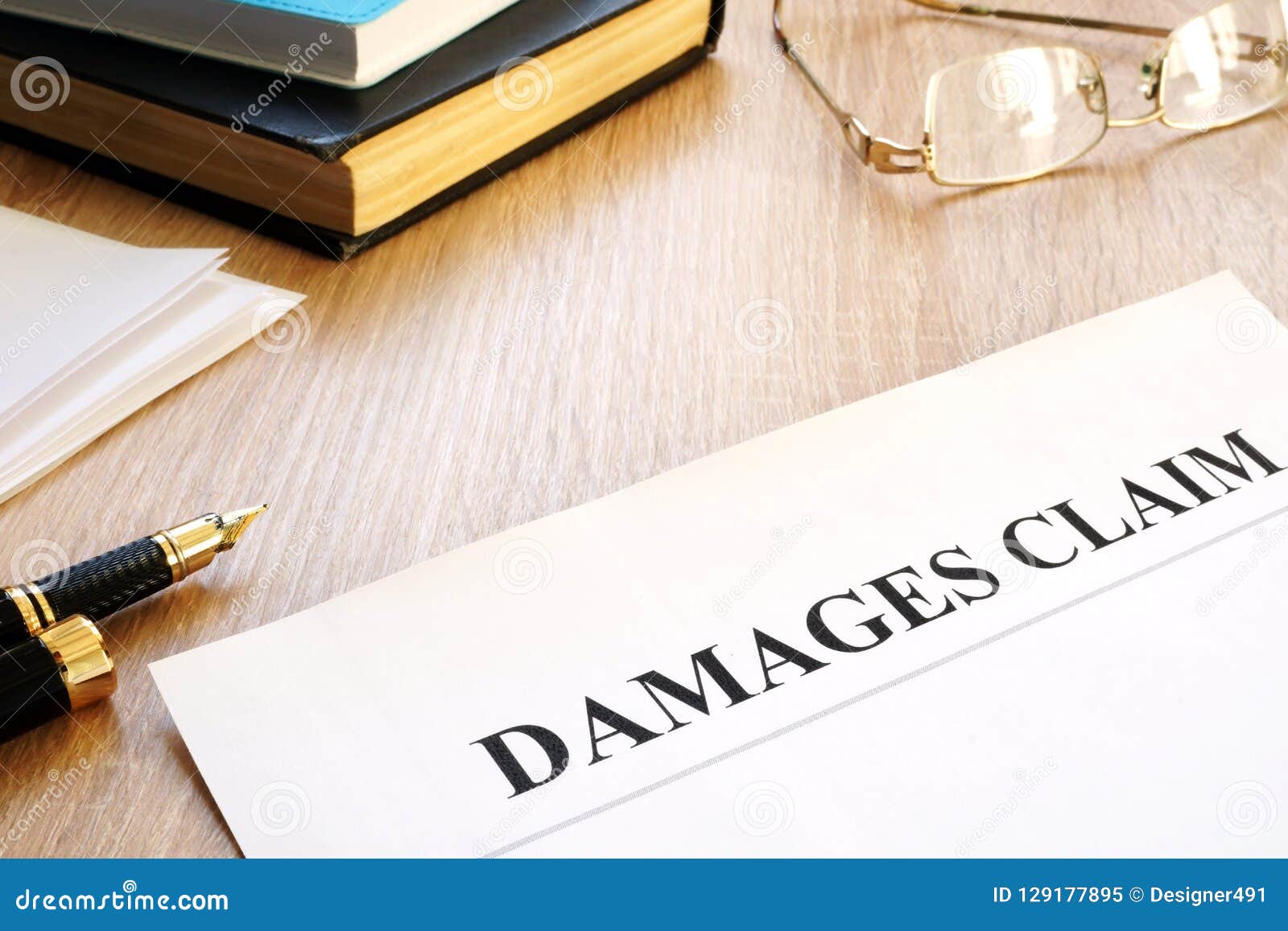 damages claim form and pen. insurance.
