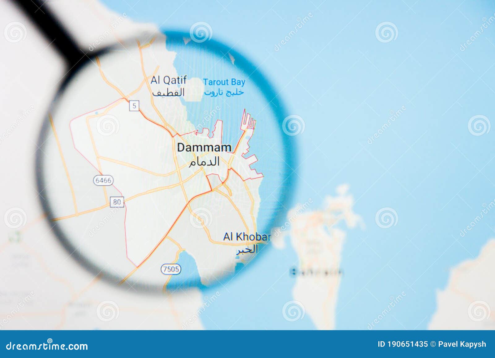 dammam city visualization illustrative concept on display screen through magnifying glass