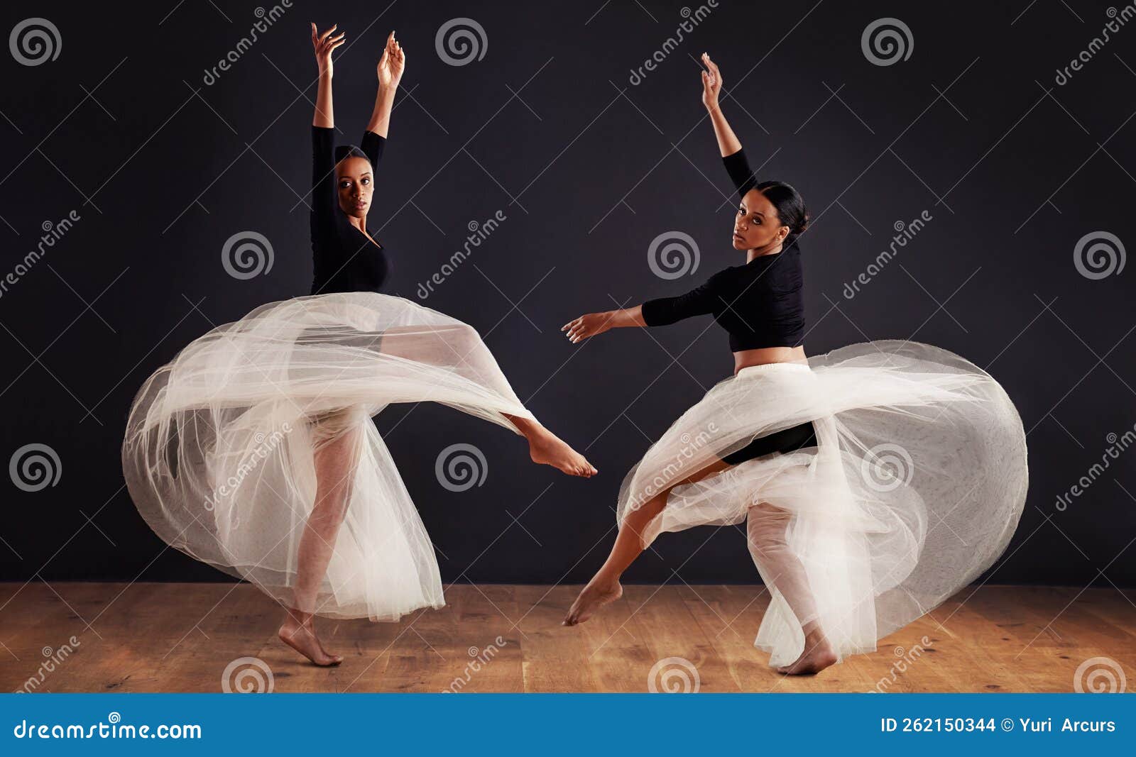 Dance of the Wind. Two Young Female Contemporary Dancers Using a Soft