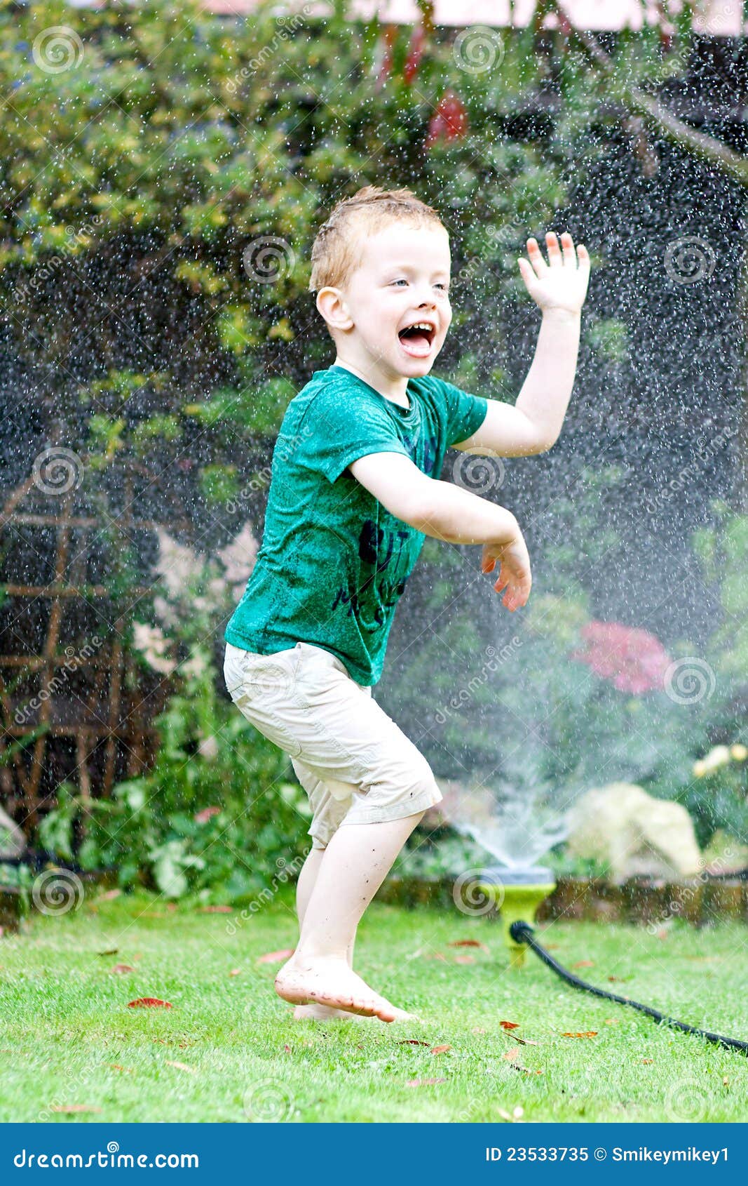 Dancing in the sprinkler stock image. Image of soaking 23533735