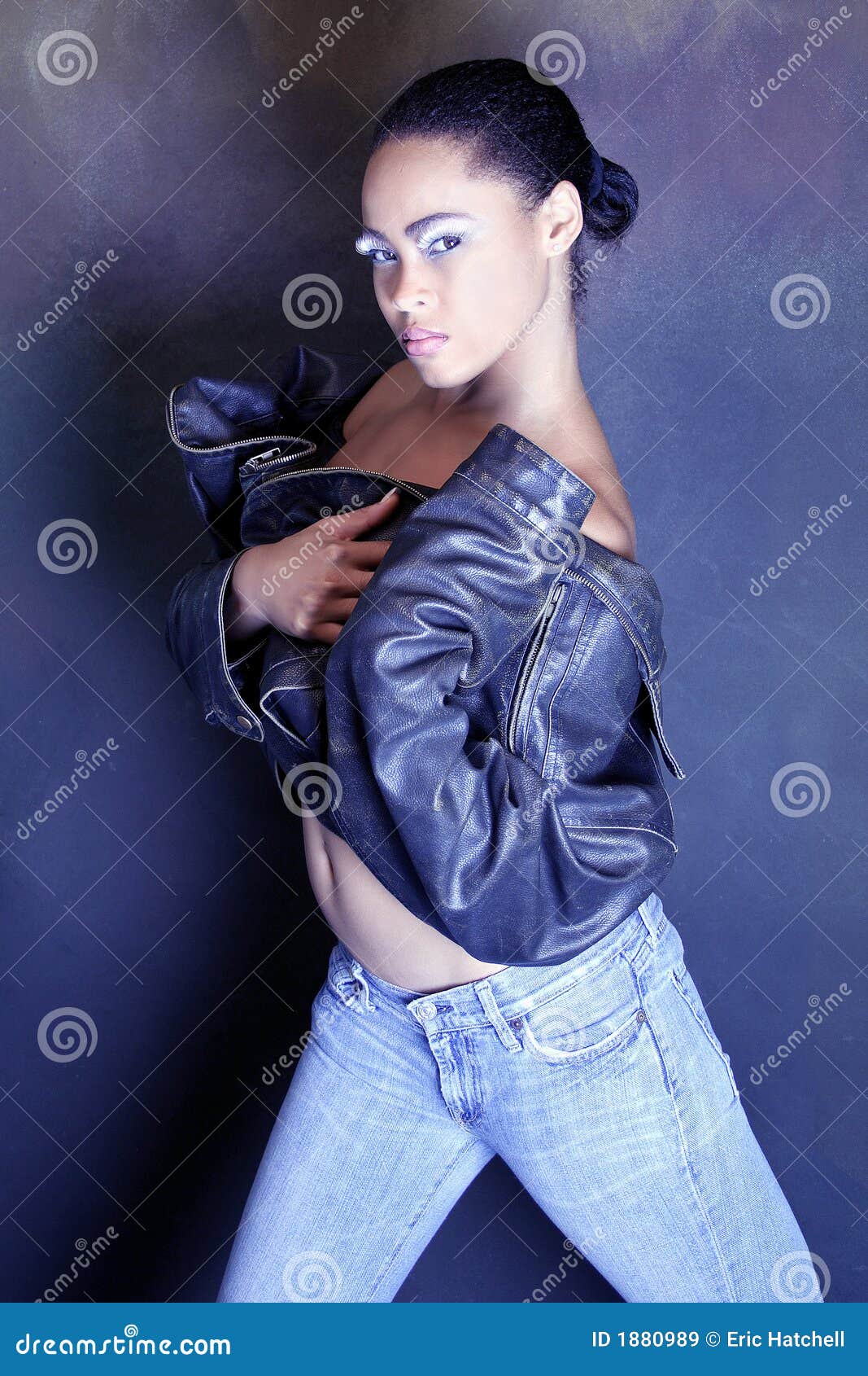 Teenage African American Girl Wearing A Leather Jacket, Showing Her ...