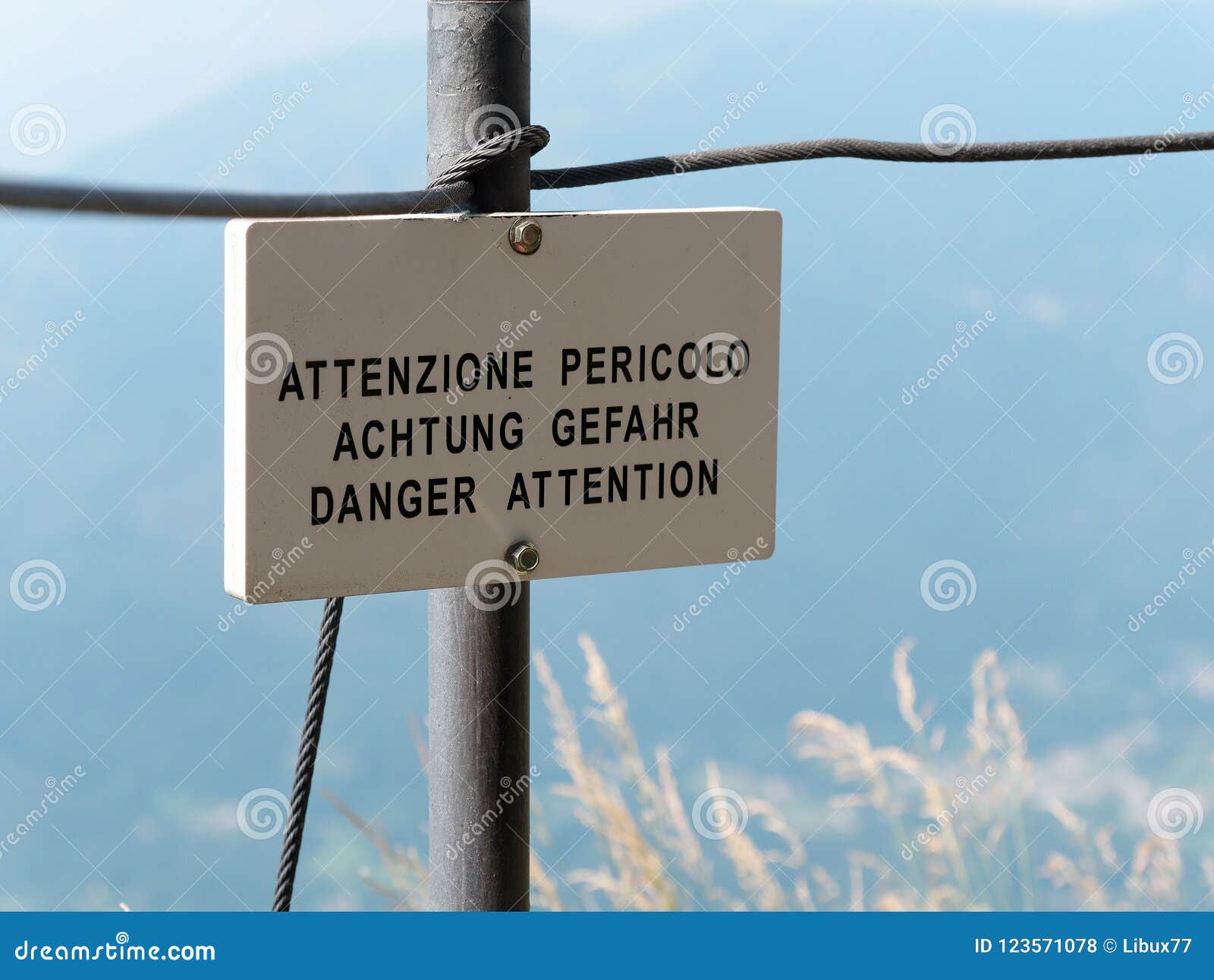 danger attention translation signpost or signboard mountain environment