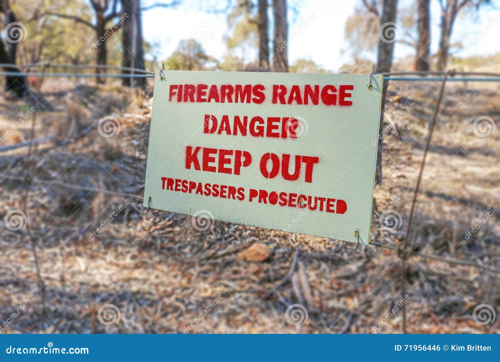 danger firearms range keep out trespassers prosecuted sign on fence