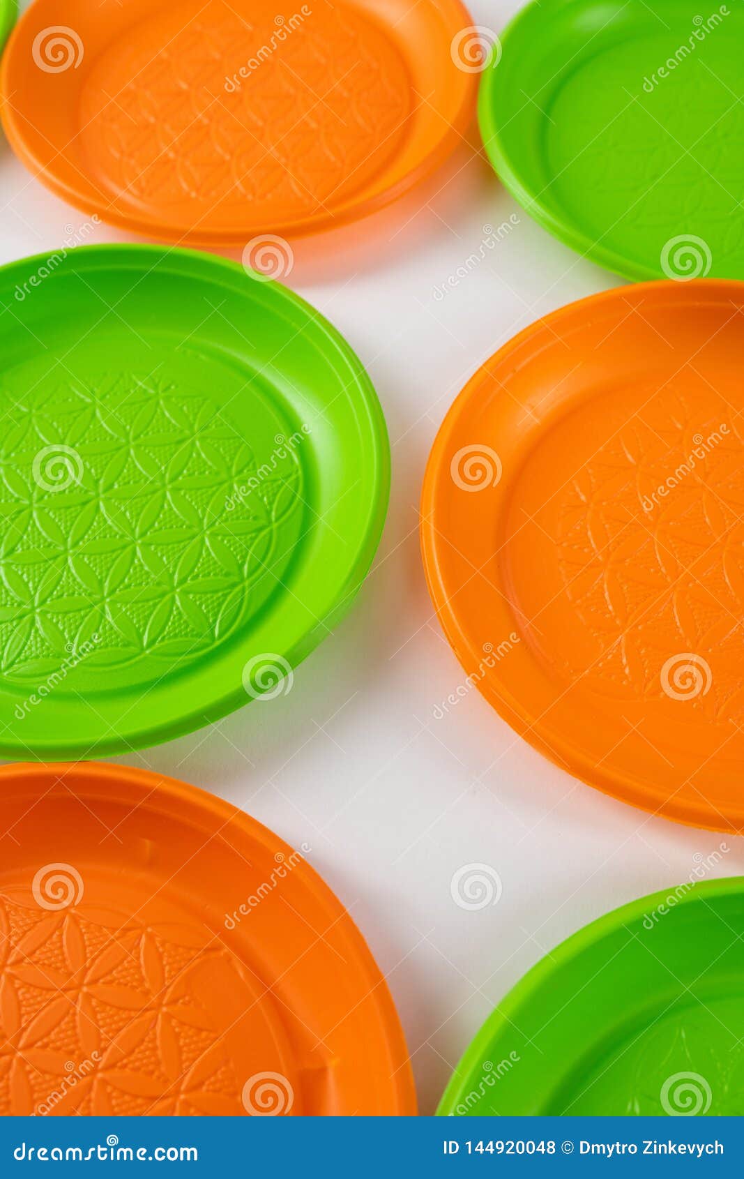 Dangerous Green and Orange Disposable Plates Made of Harmful Plastic