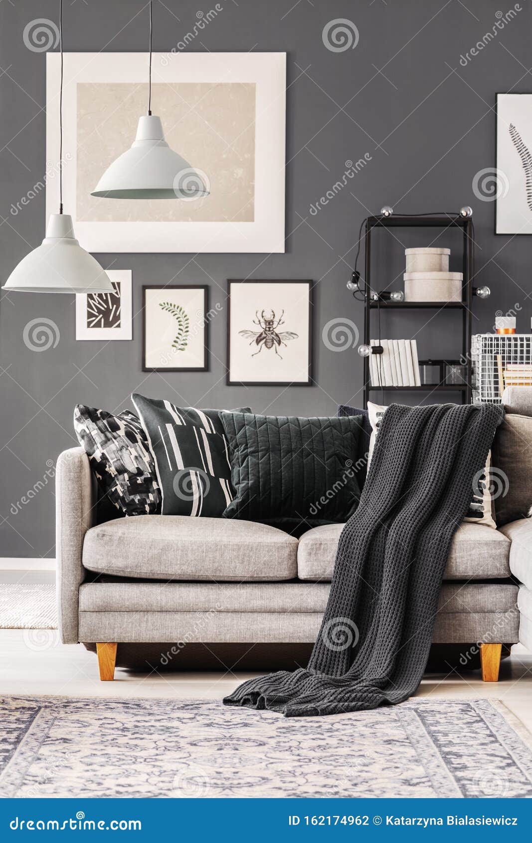 Dark Blanket And Pillows On Grey Corner Sofa In 