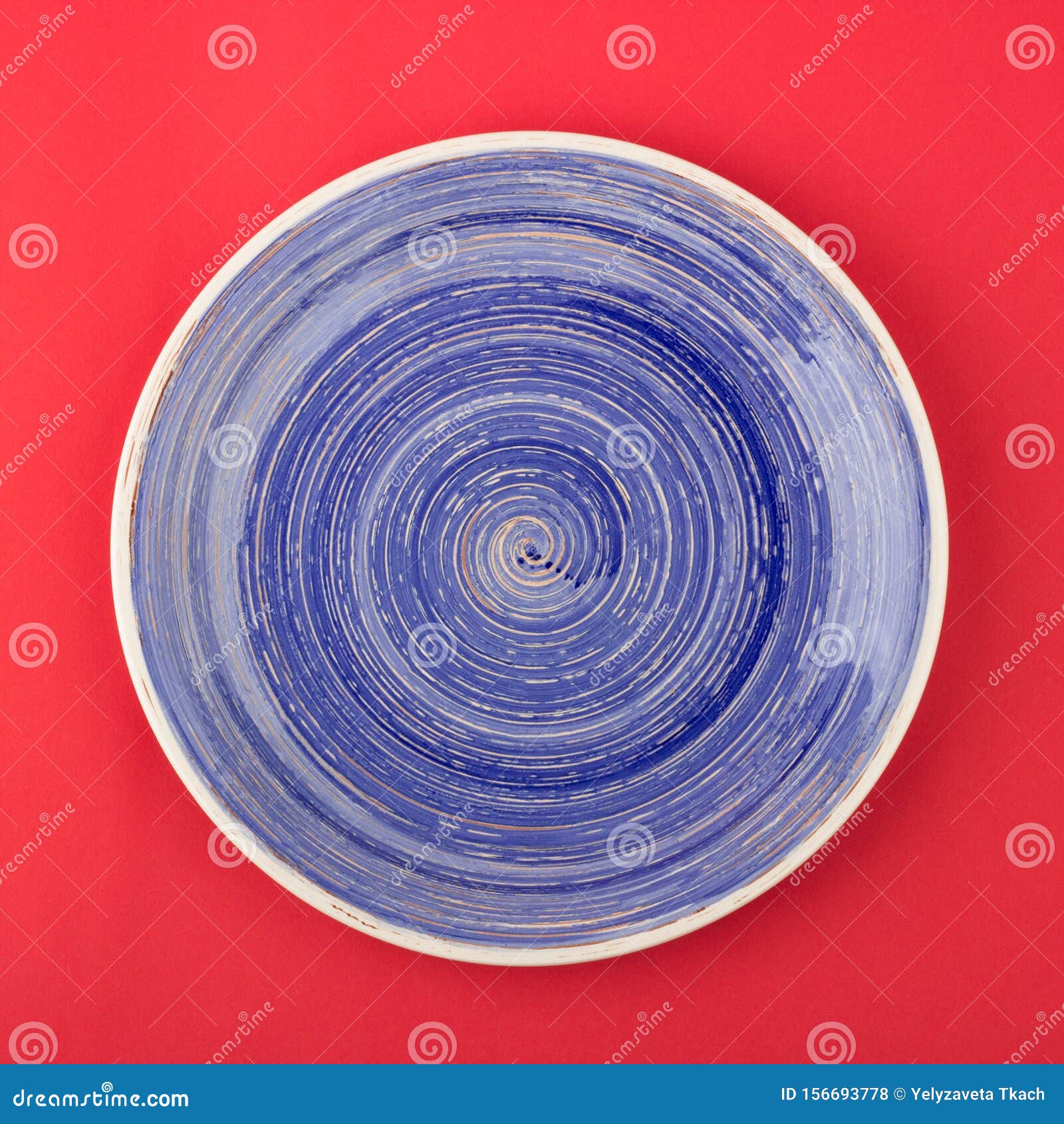 Dark Blue Plate on the Red Background Stock Photo Image of