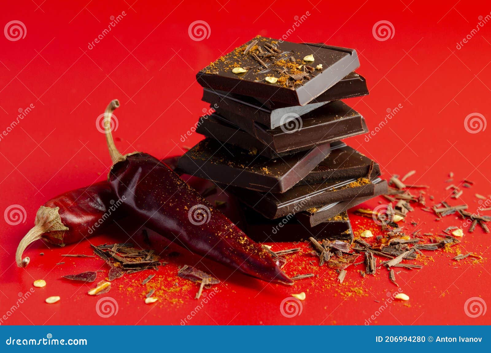 Dark Chocolate with Chili Pepper on Red Background Stock Photo Image