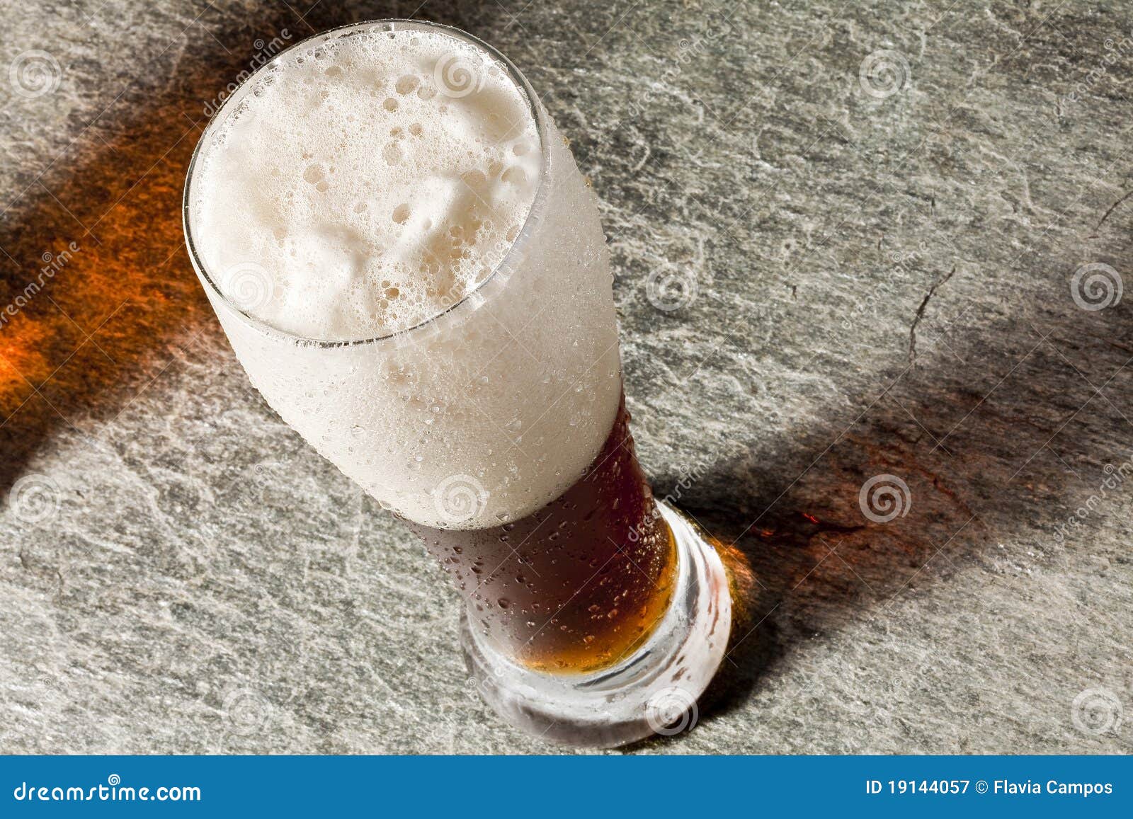dark cold beer with frothy