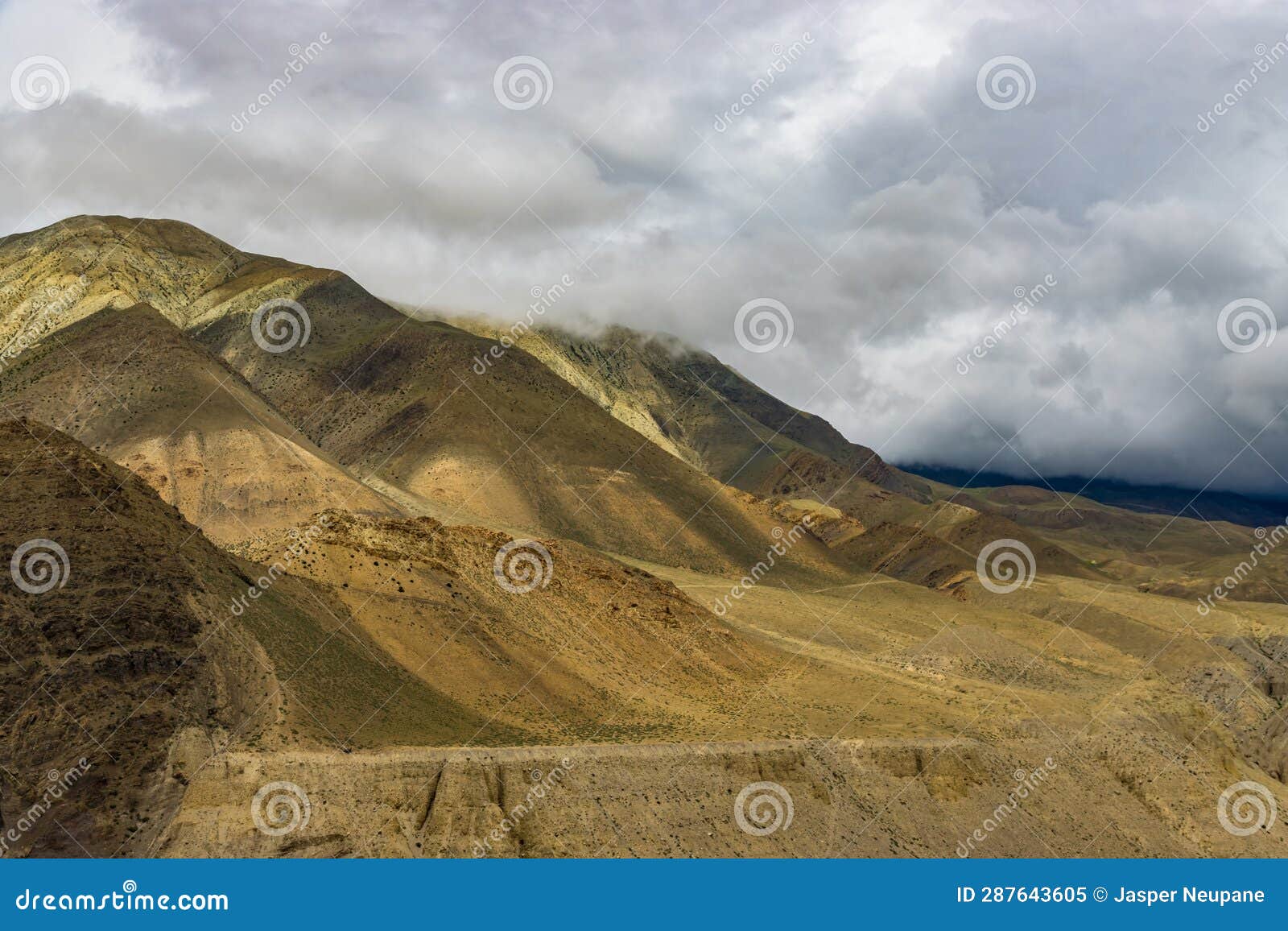 Dark Dramatic Desert Landscape with Foggy Mountains and Distant Houses ...