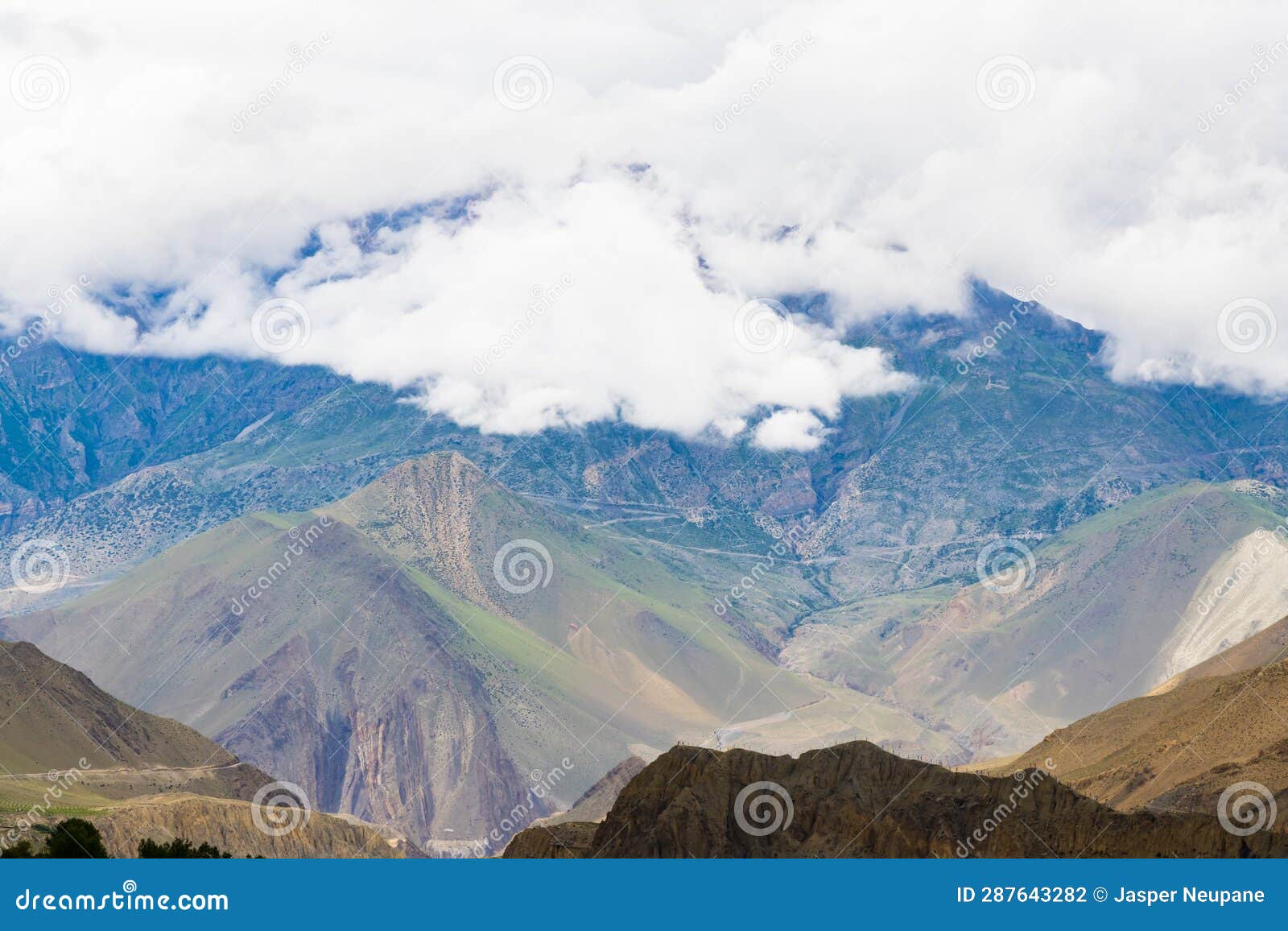 Dark Dramatic Desert Landscape with Foggy Mountains and Distant Houses ...