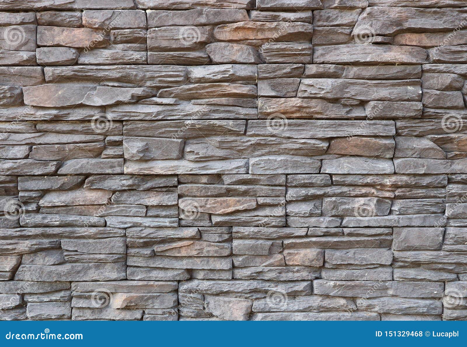 Dark Gray and Brown Exterior Wall Cladding Made of Irregular Natural