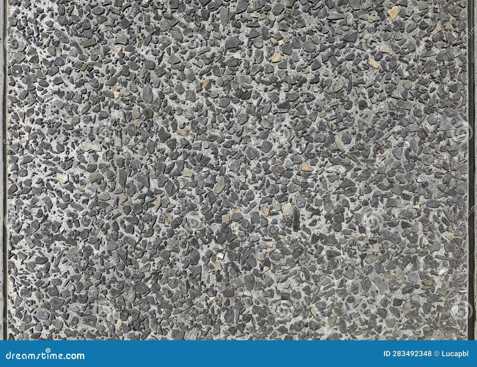 Dark Gray Exposed Aggregate Concrete for Walls or Floors. Stock Photo