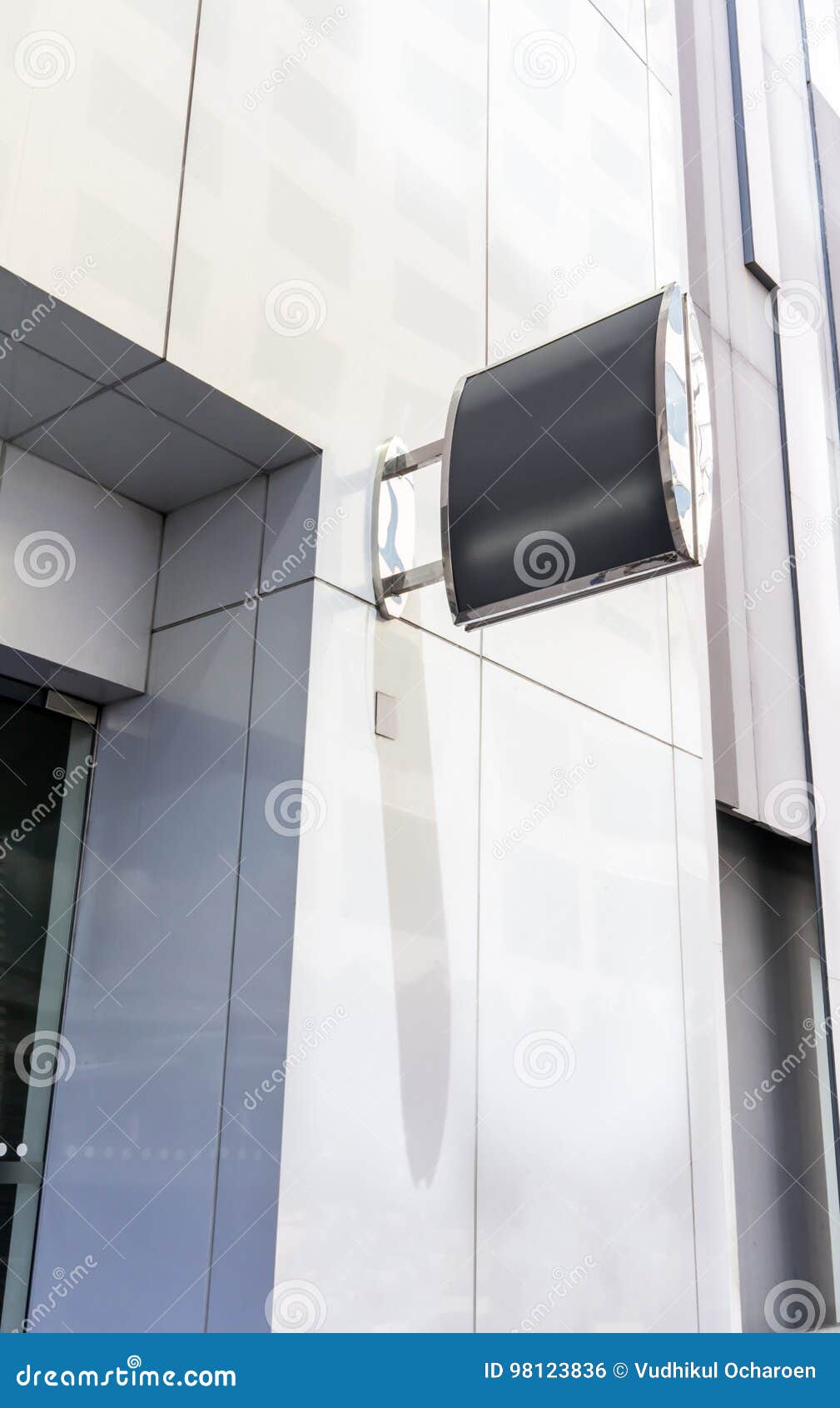 Dark Grey Metal Frame Mockup in Front of Modern Building Stock Photo
