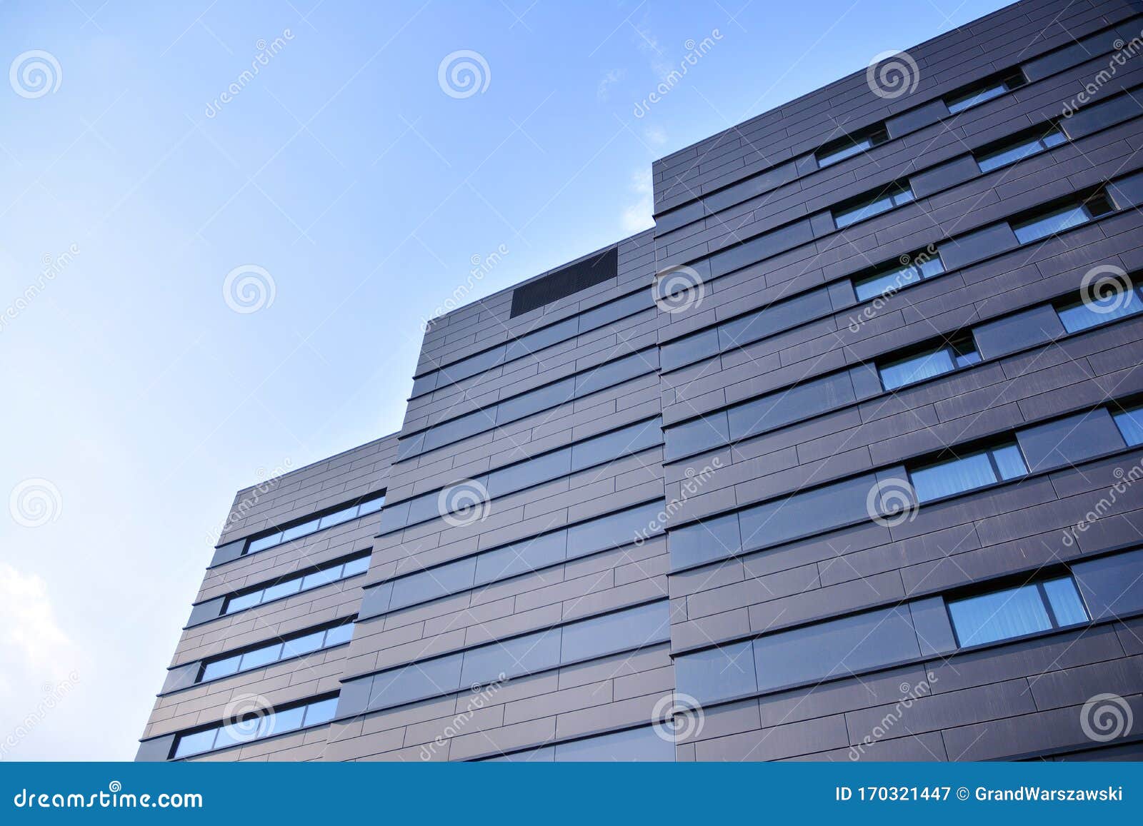 A View at a Straight Facade of a Modern Building with a Dark Grey ...