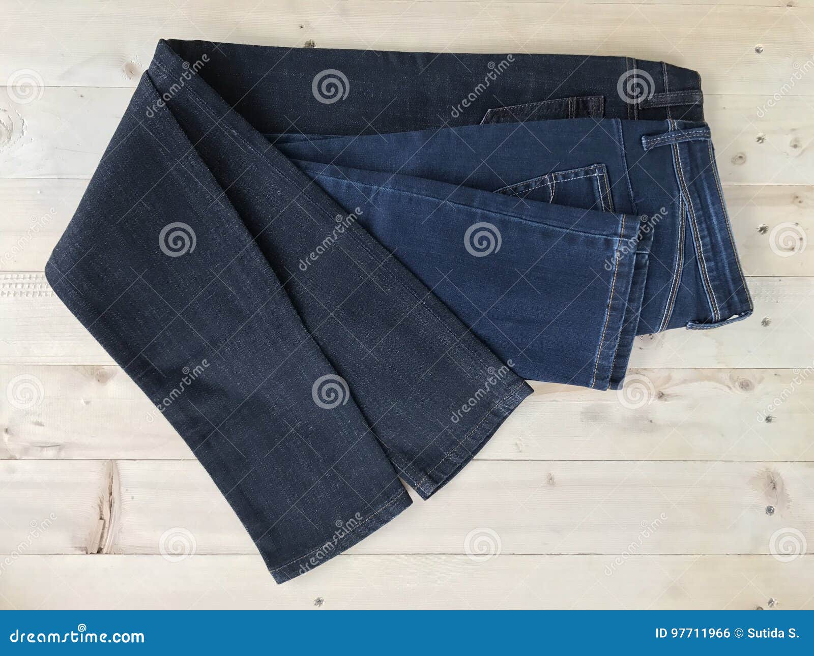 Jeans pant on wood floor stock photo. Image of denim - 97711966