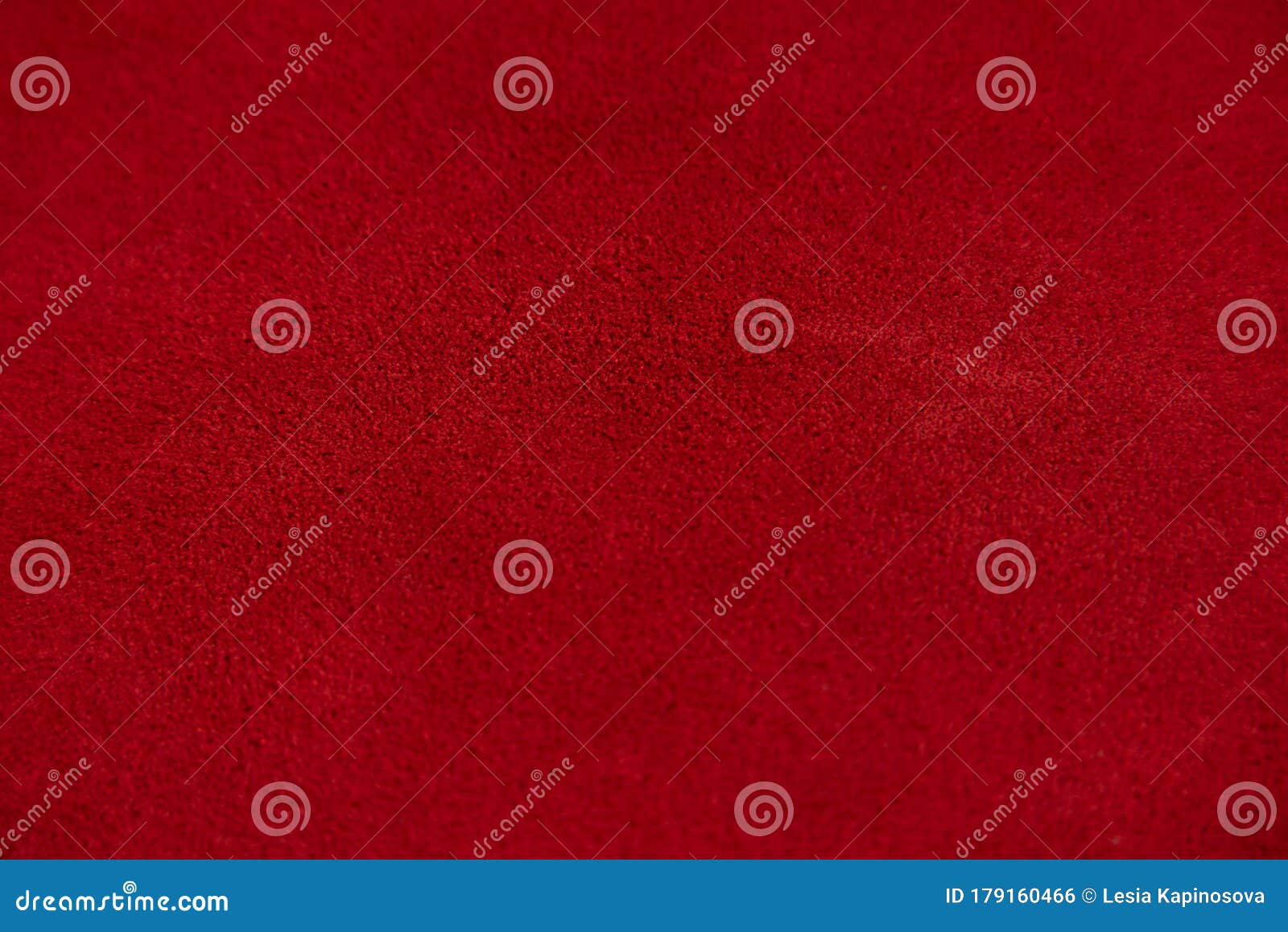 dark red matte background of suede fabric, closeup. velvet texture of seamless wine leather. felt material macro.