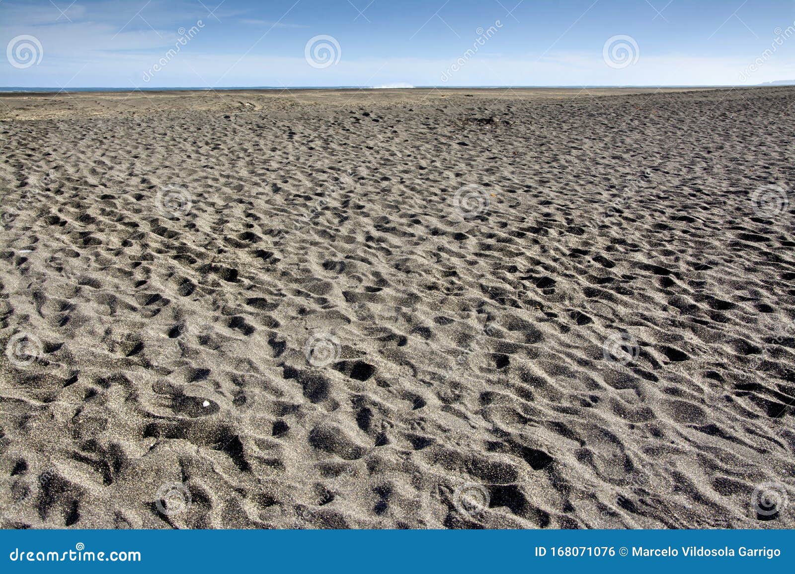 dark sand beach in chile.