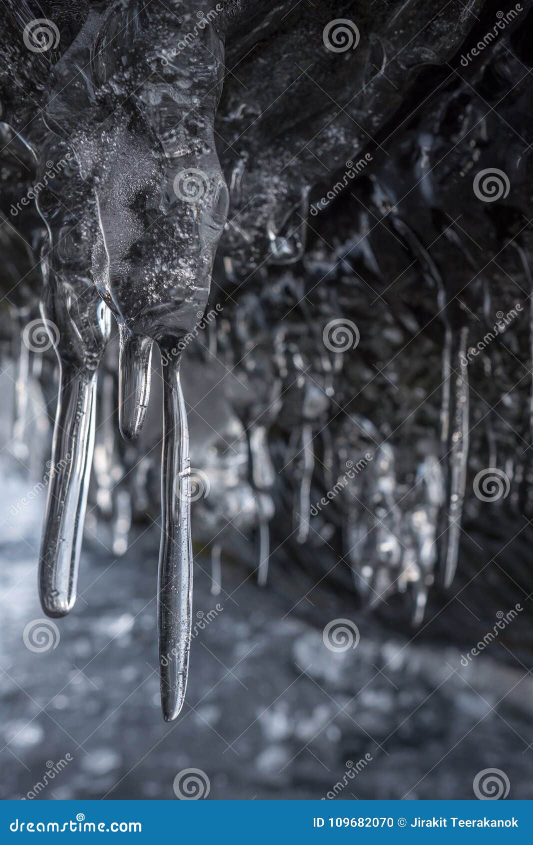 Dark And Scary Branches Of Icicles In The A Cave Several