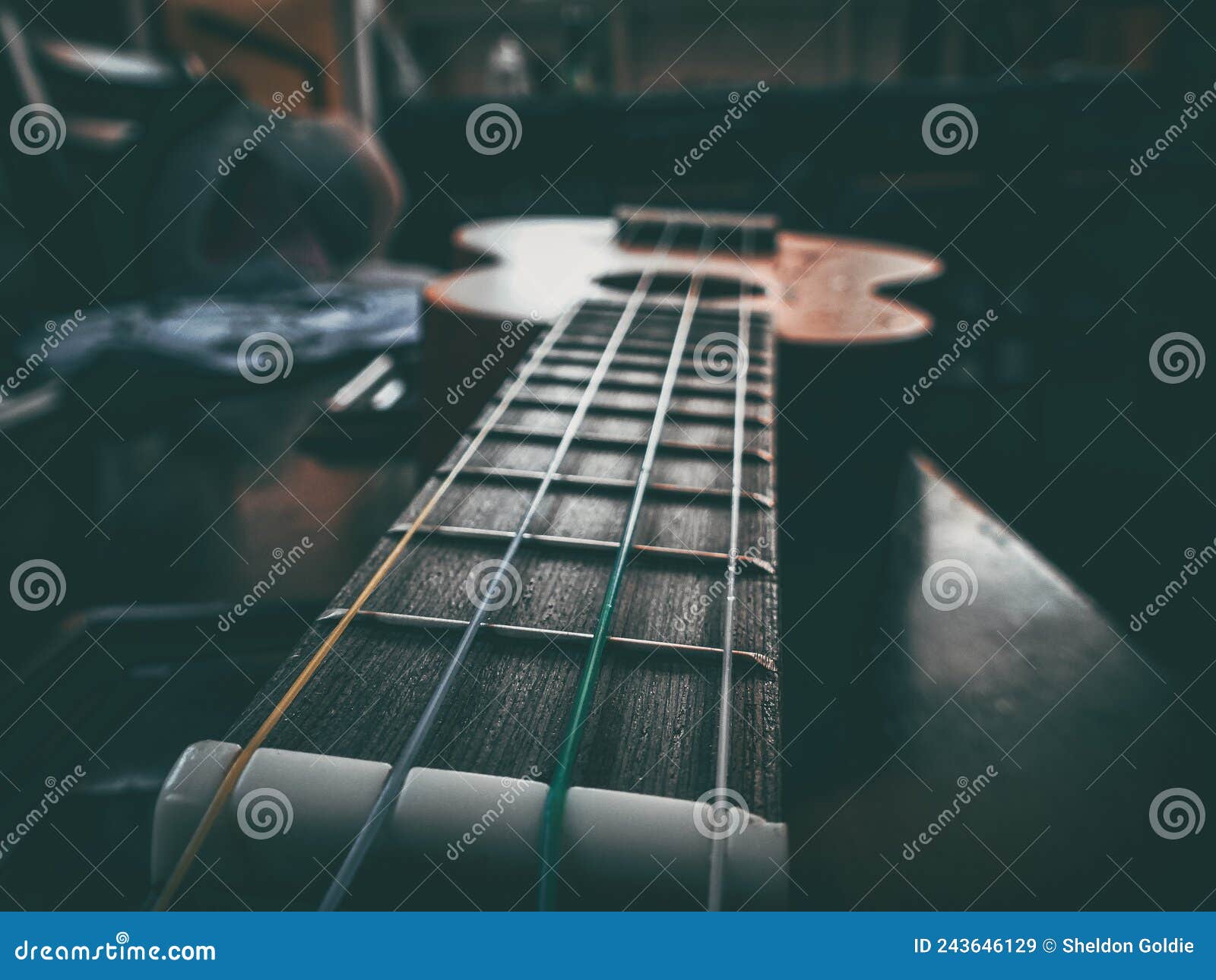 Dark theme ukulele editorial stock image. Image of reflection 243646129