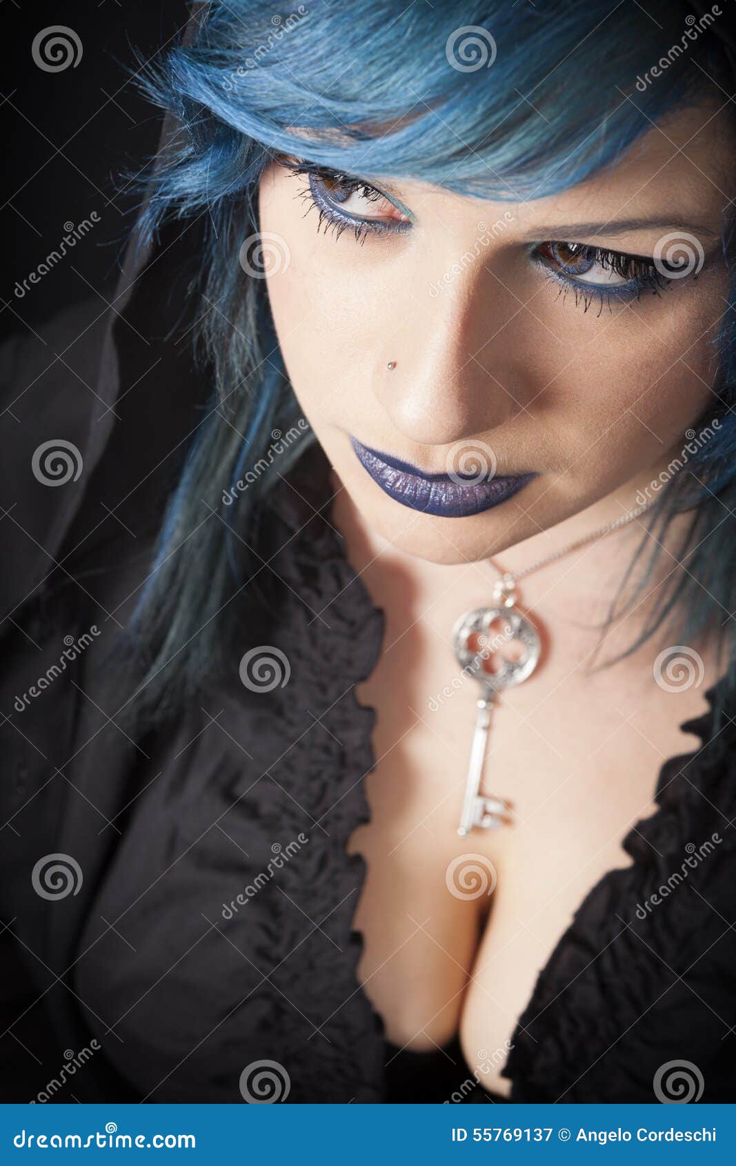 Dark Woman With Blue Hair And Lipstick. Key Pendant. Dark 