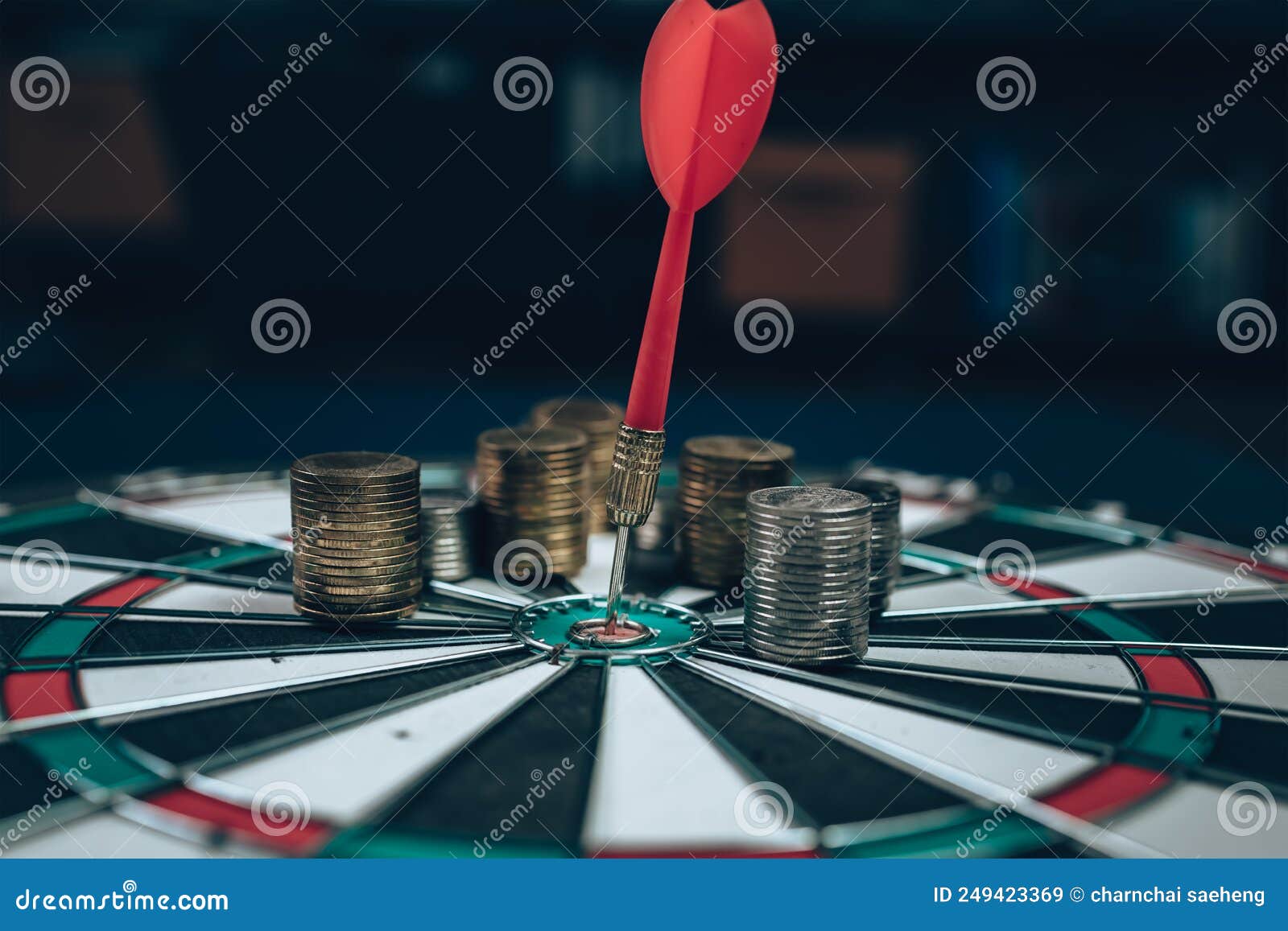 dart board has dart arrow hitting of a shooting target for business targeting and good success