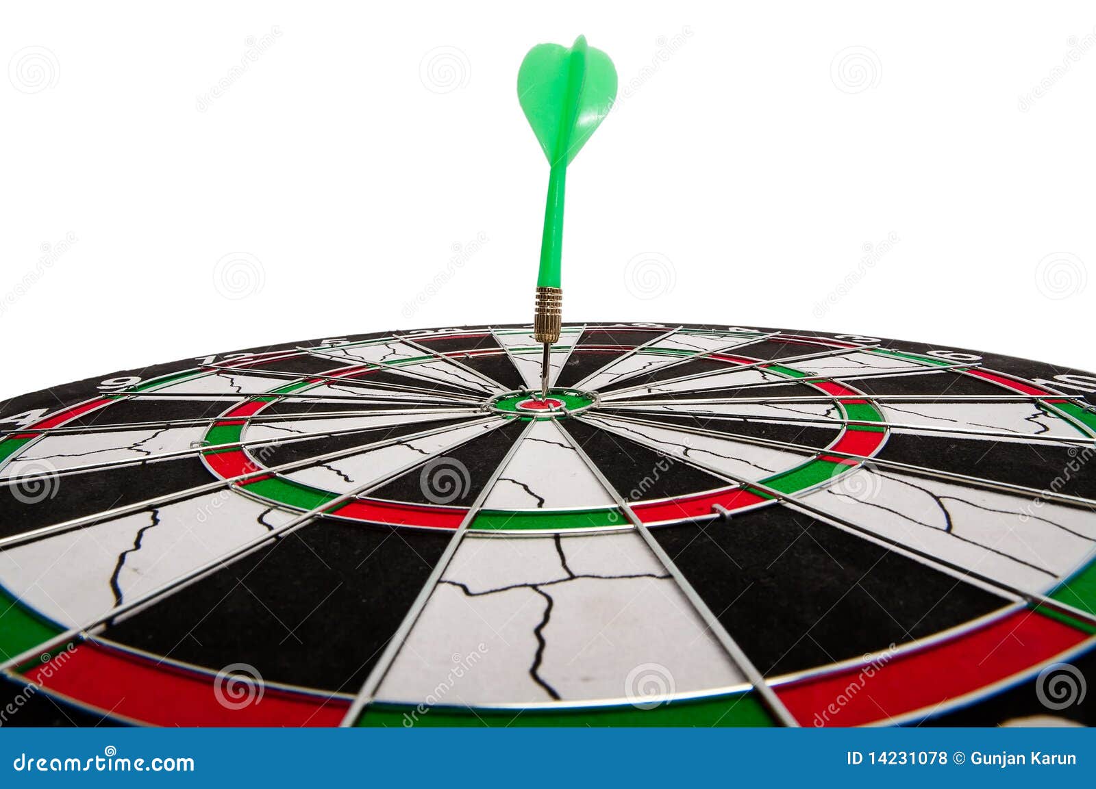 dart in bullseye of dartboard