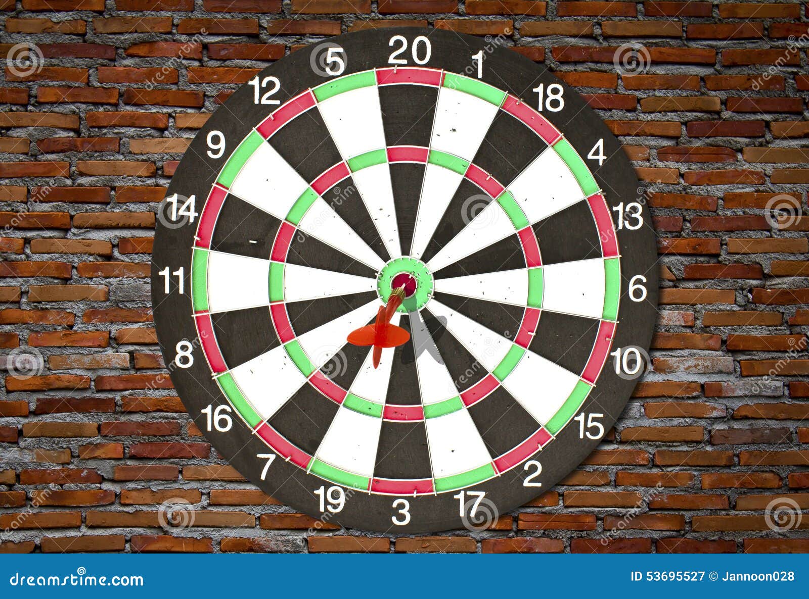 Dartboard on brick wall stock image. Image of dartboard 53695527