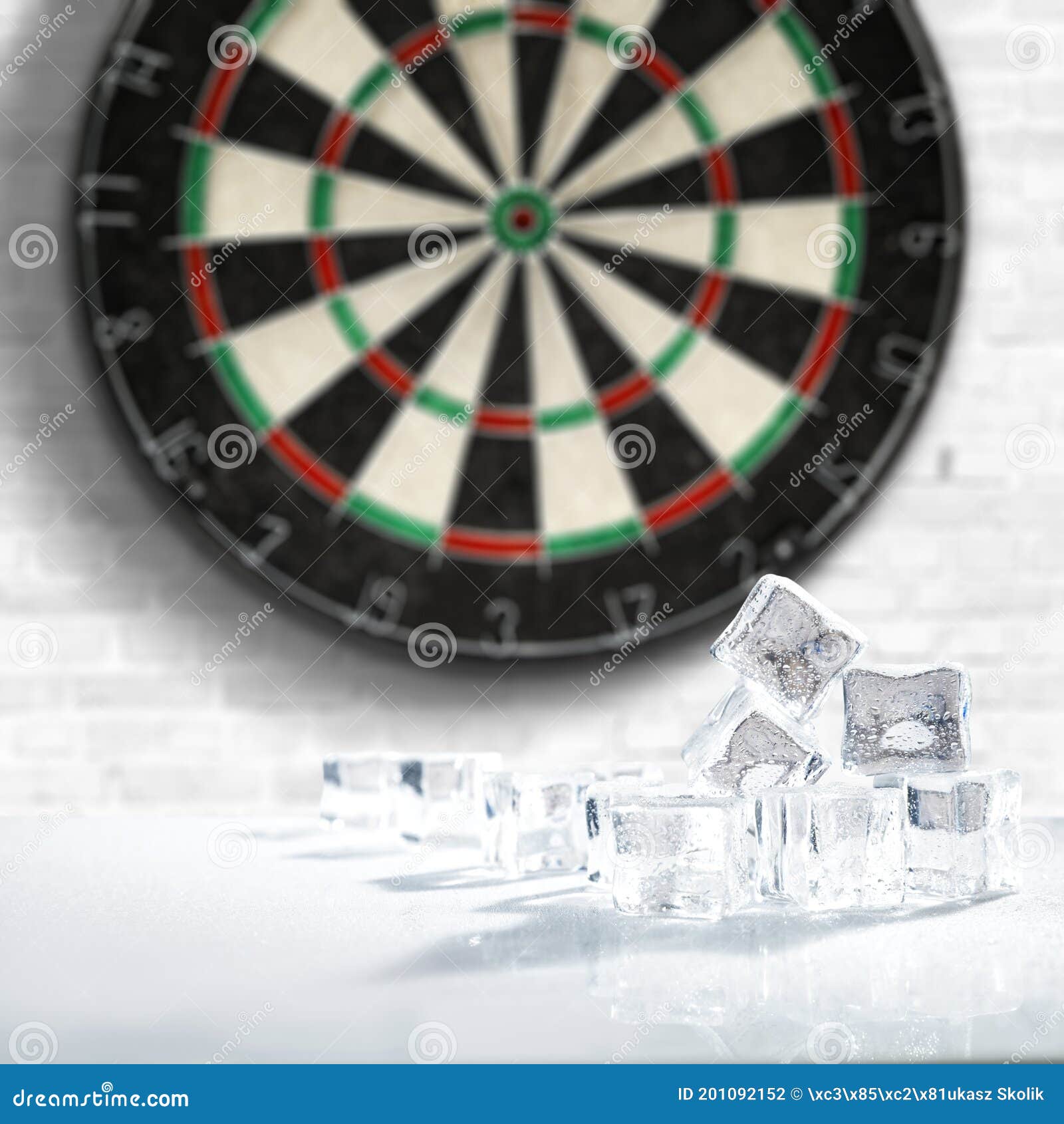 dartboard with light grey wall background. ice cubes on white table with empty space. darts playing time.