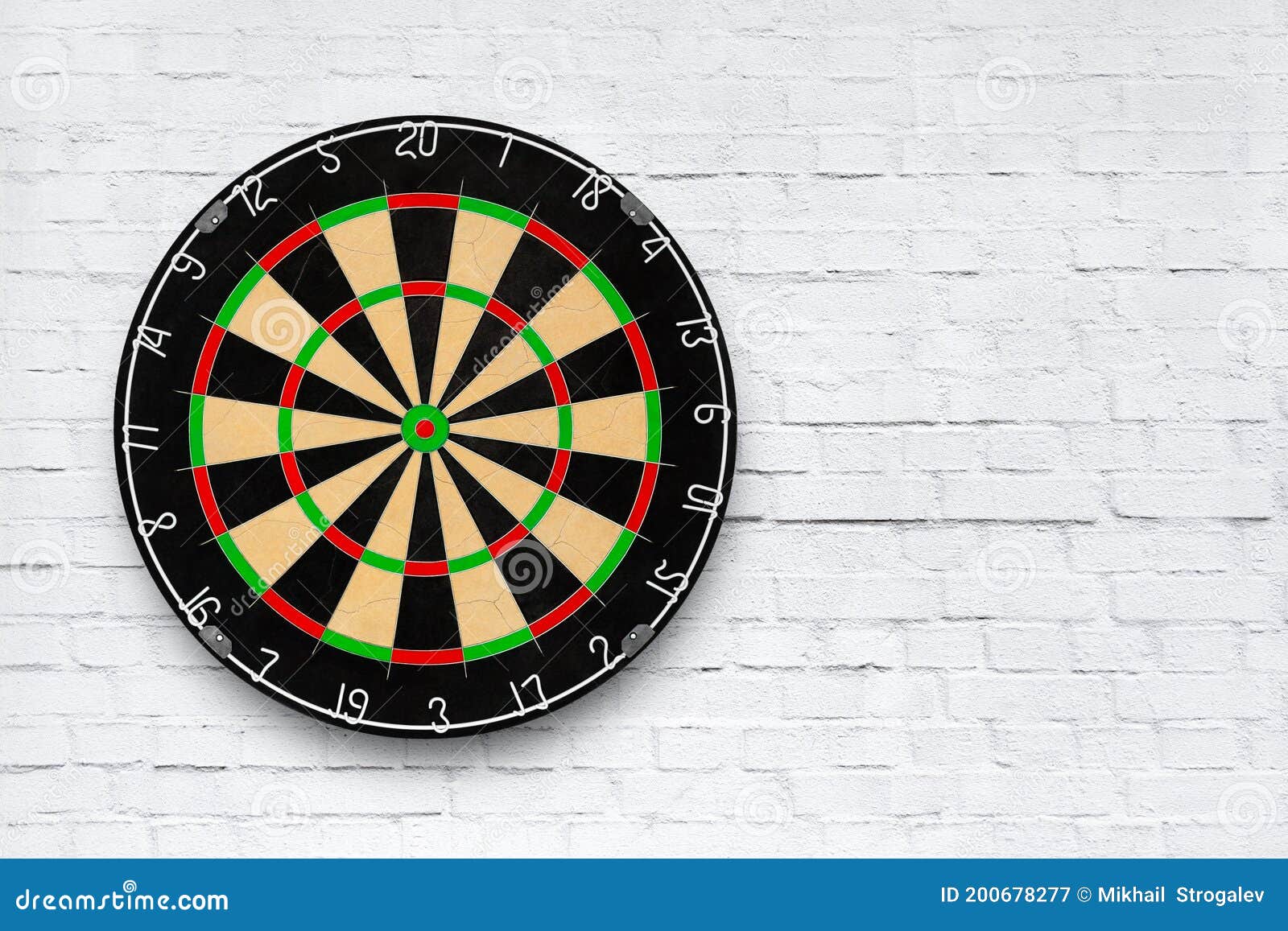 Dartboard on a White Brick Wall with Copy Space Stock Image Image of