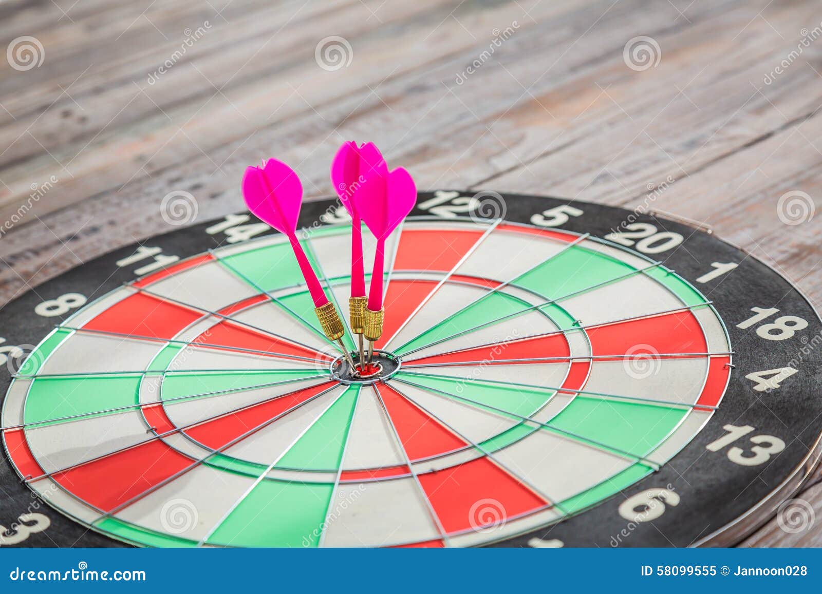 Dartboard on wood wall stock image. Image of color, metal 58099555