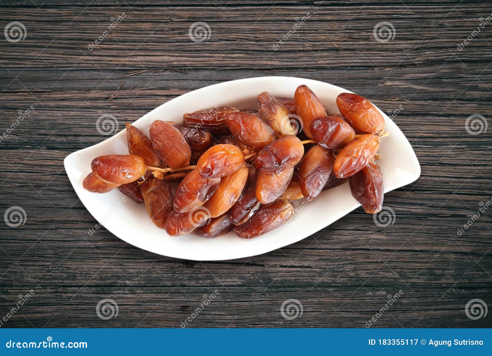 date fruits on saucer  on white