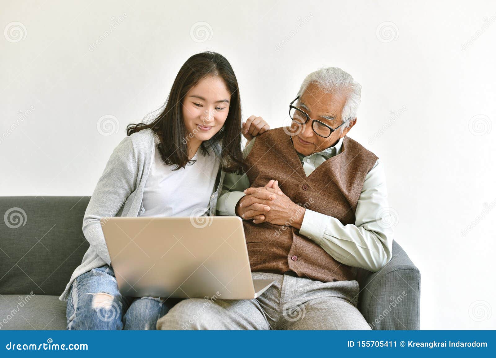 daughter and elderly father using laptop computer together, senior people spend time learning to use social media and digital.