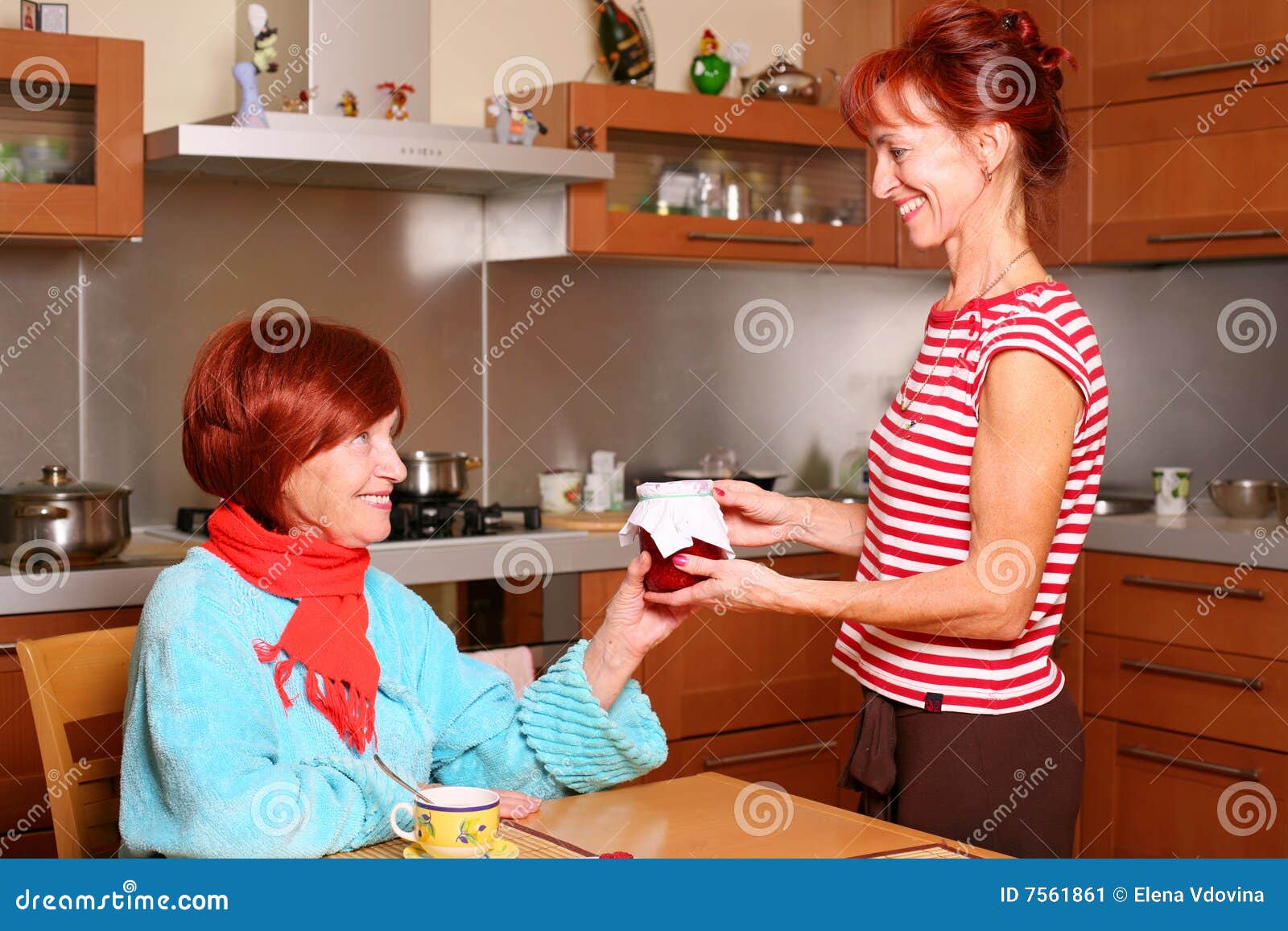 Daughter Holds a Jar of Jam for Her Mother Stock Image Image of