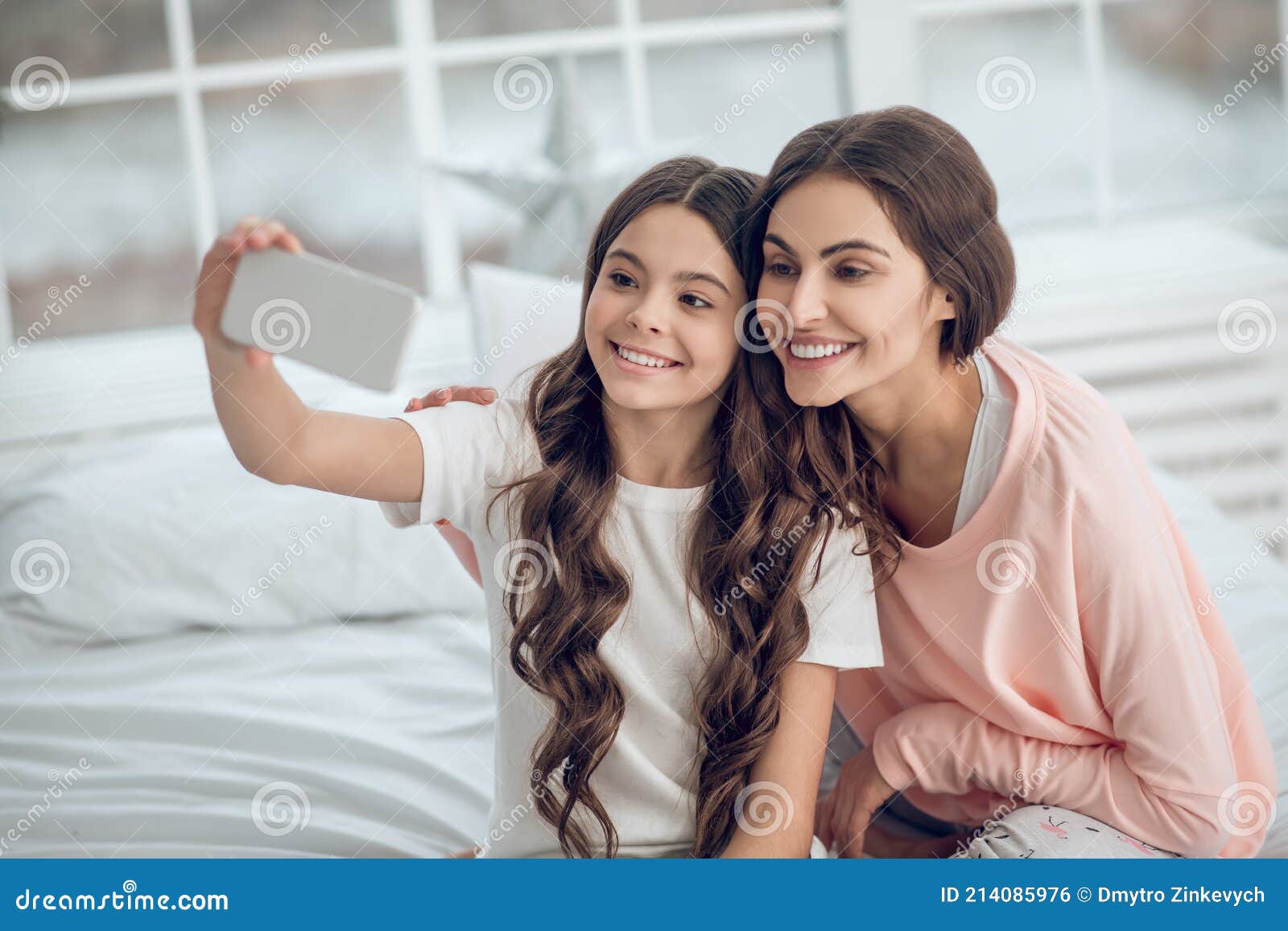 Daughter with Mom Taking Selfie on Smartphone Stock Photo - Image of ...