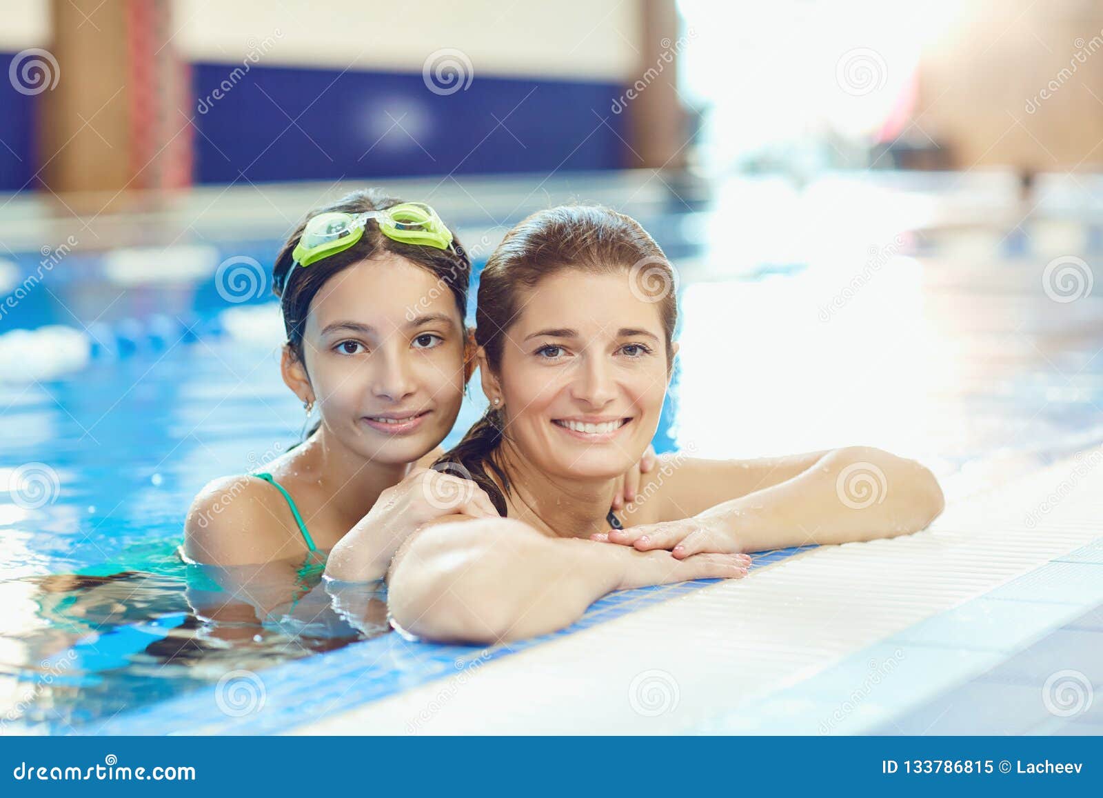 The Daughter And Mother Swim In The Swimming Pool Stock Image Image Of Happiness Healthy