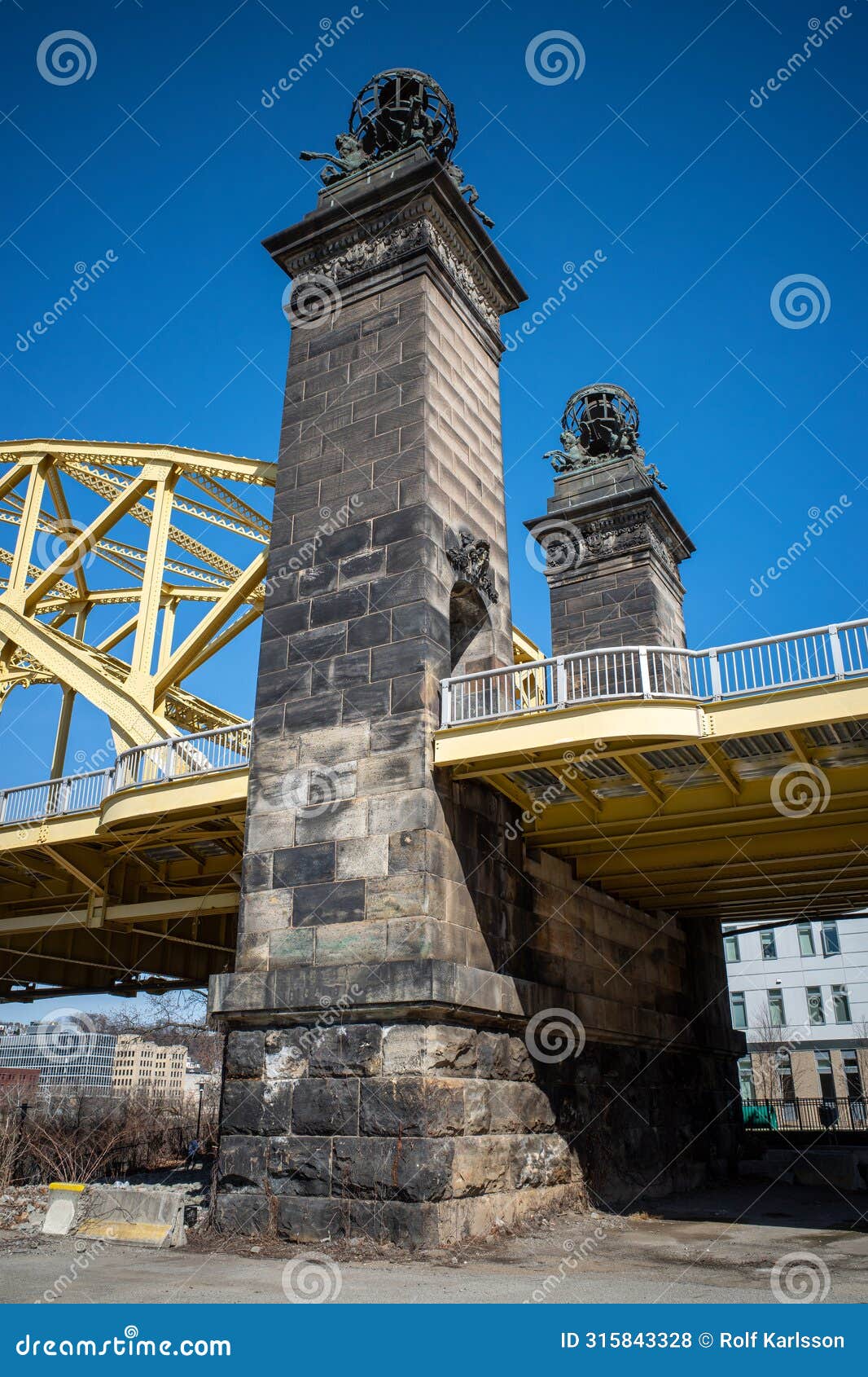 david mccullough bridge, or sixteenth street bridge, strip district, pittsburgh, from beneath with clear blue sky