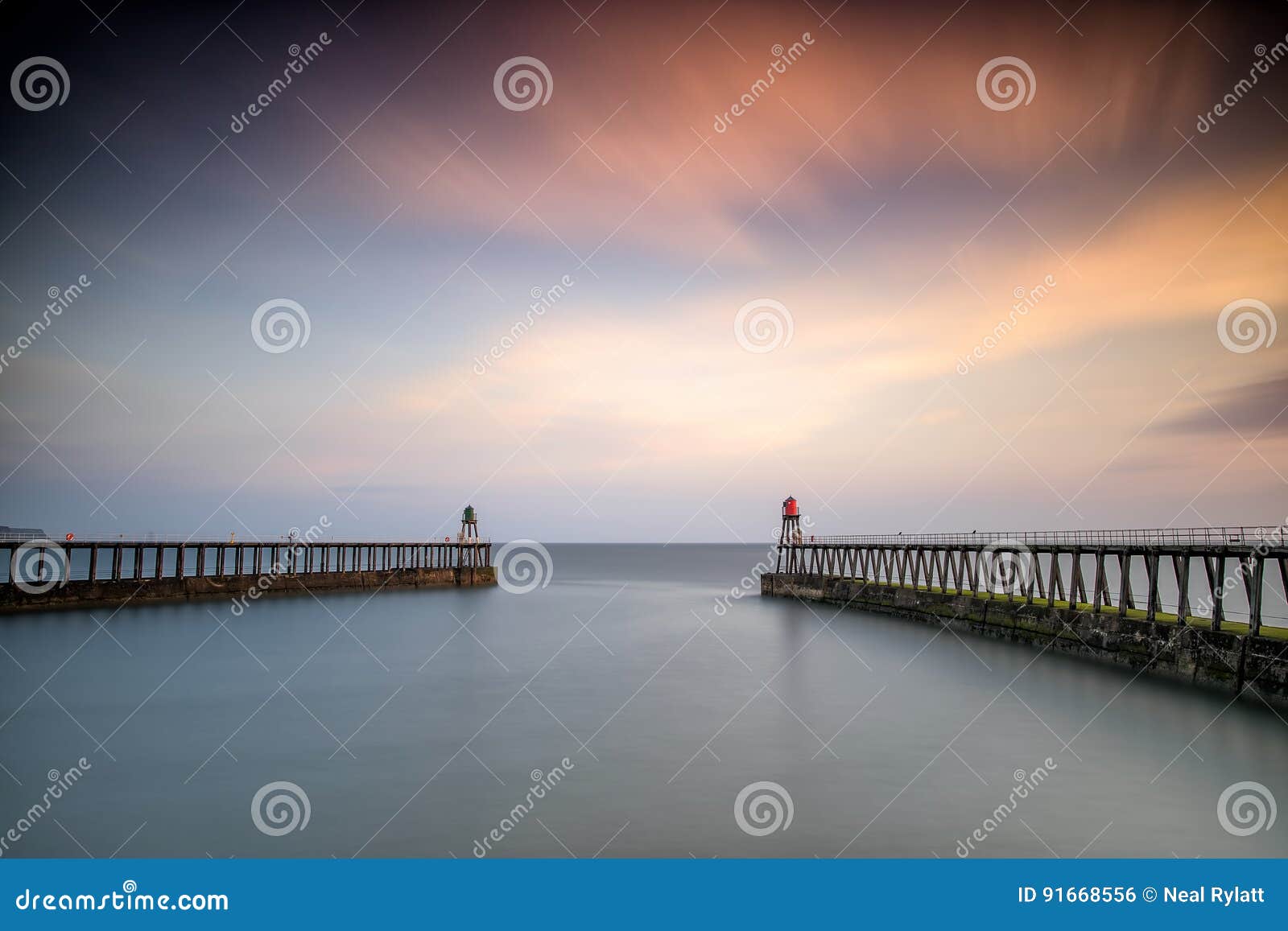 dawn, whitby harbour piers, yorkshire uk