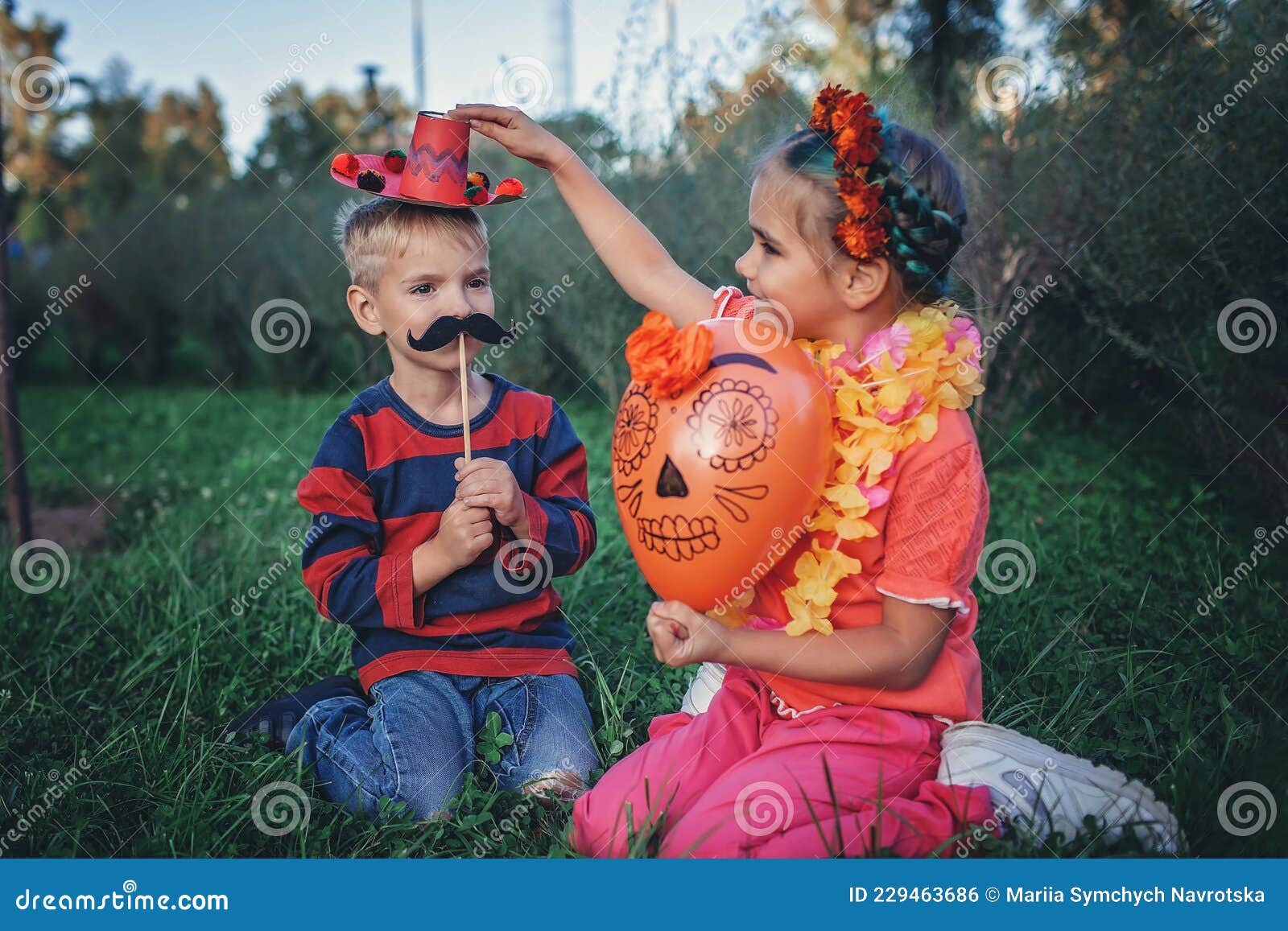 day of the dead and halloween. cute kids wearing in themed costumes for fun party