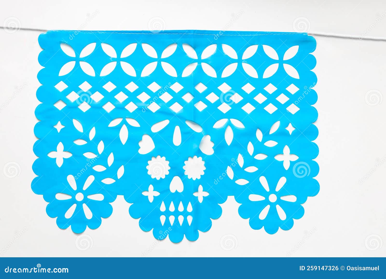 day of the dead, papel picado with a skull head, blue traditional mexican paper cutting flag.