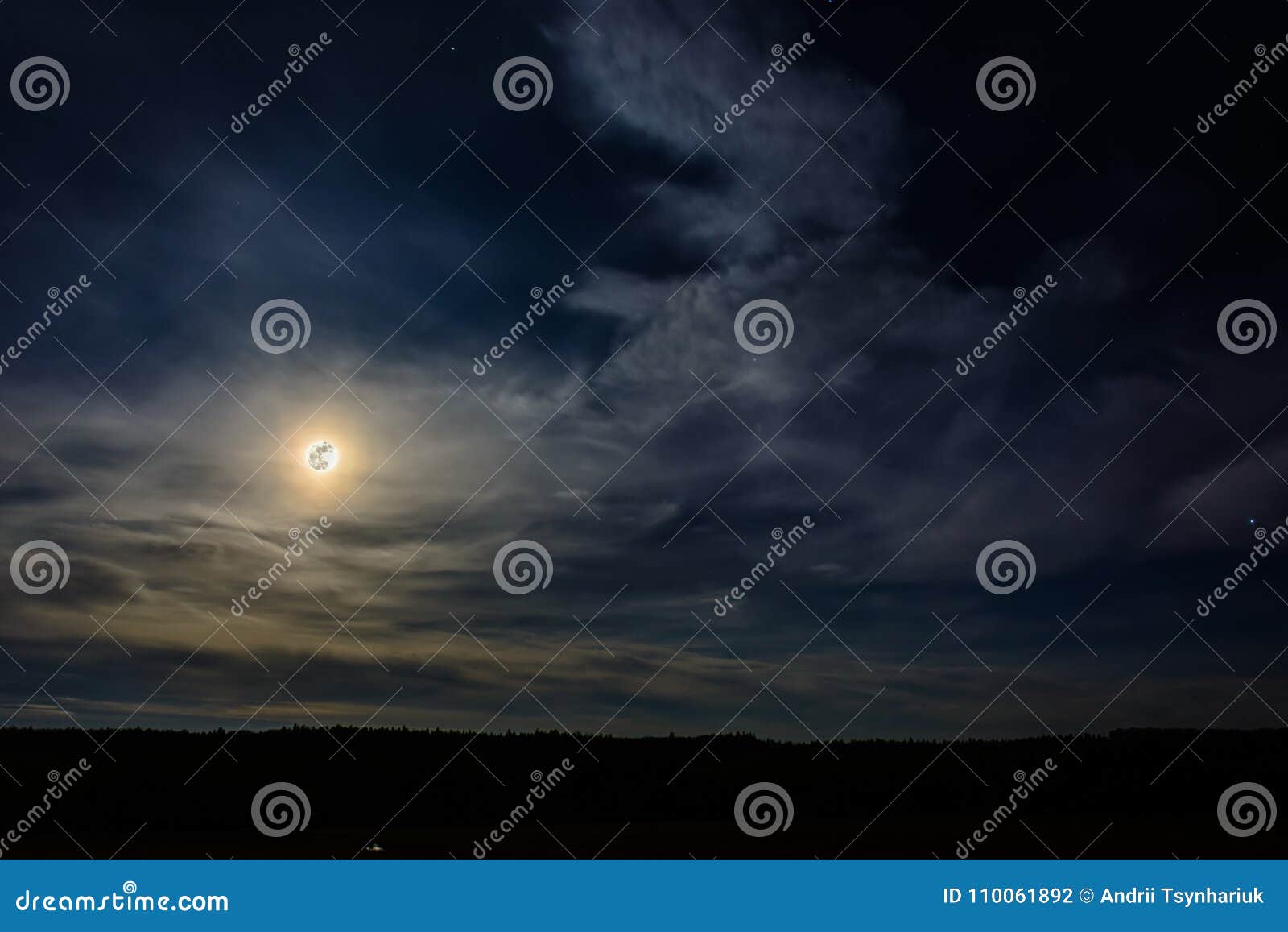 A Wonderful Full Moon Has Descended Over Ukrainian Carpathians in Blurry Clouds Stock Photo